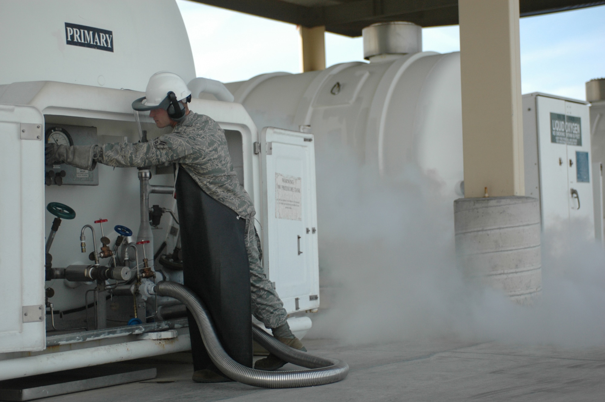Airman 1st Class Timothy Kline works the cryogenics tanks. Airman Kline is a member of the 60th Logistics Readiness Squadron's fuels management flight, which the American Petroleum Institute recently named the Air Force's best. (U.S. Air Force photo/Nick DeCicco)