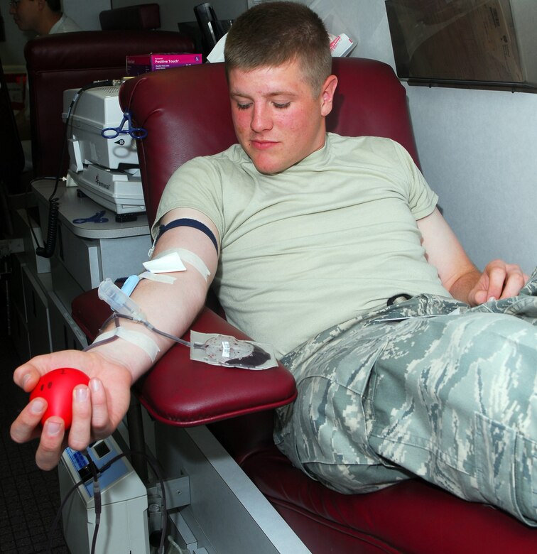 VANDENBERG AIR FORCE BASE, Calif. – Airman William Ochsenbauer, a 532nd Training Squadron student, donates a pint of blood June 9 at the Pacific Coast Club’s parking lot here. The blood drive was in response to President Obama's call for public service. (U.S. Air Force photos/Airman 1st Class Kerelin Molina)