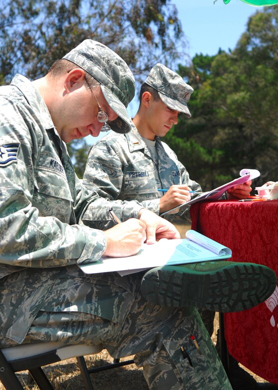 VANDENBERG AIR FORCE BASE, Calif. – Staff Sgt. William Kaelber, a 30th Launch Support Squadron unit training manager, and 2nd Lt. Michael Petrelli, a 392nd Training Squadron student, fill out a questionnaire prior to donating blood June 9 at the Pacific Coast Club here. The blood drive recruited approximately 38 donors and collected 25 units of blood. (U.S. Air Force photos/Airman 1st Class Kerelin Molina)
