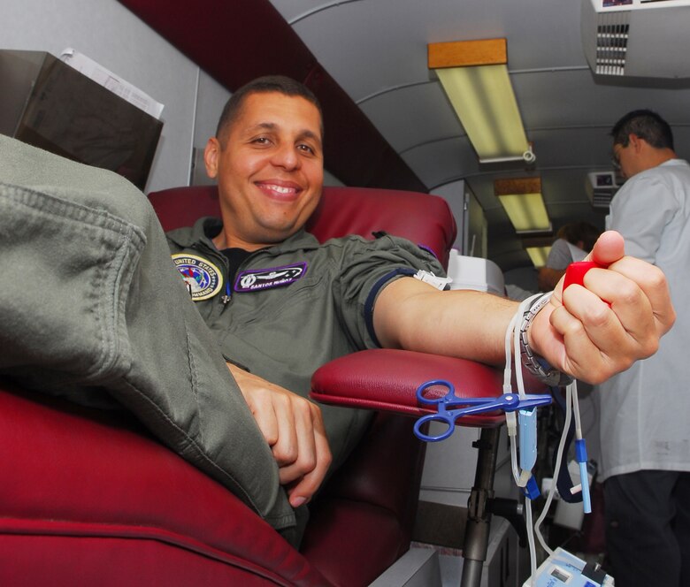 VANDENBERG AIR FORCE BASE, Calif. – Maj. Santos Munoz, Joint Functional Component Command chief of space operations plans branch, donates a pint of blood June 9 at the Pacific Coast Club’s parking lot here. Major Santos volunteered to give blood because statistics show that blood supply shortages frequently occur during the months of summer. (U.S. Air Force photos/Airman 1st Class Kerelin Molina)