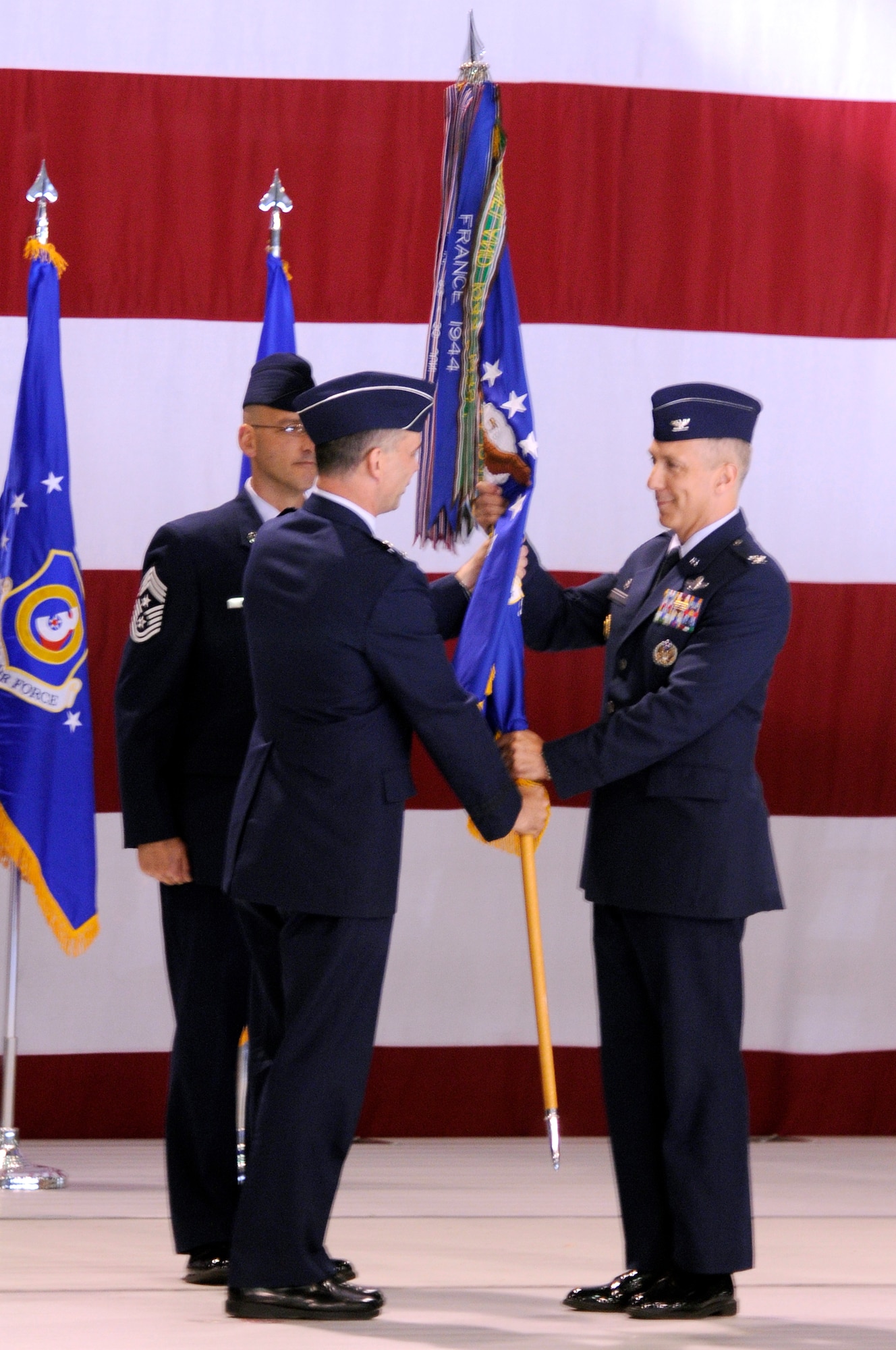 U.S. Air Force Col. Thomas F. Gould receives the guidon from Maj. Gen. Mark R. Zamzow, 3rd Air Force vice commander, during the 435th Air Base Wing Change of Command ceremony, Ramstein Air Base, Germany, June 11, 2009. (U.S. Air Force photo by Tech. Sgt. Kenneth Bellard)