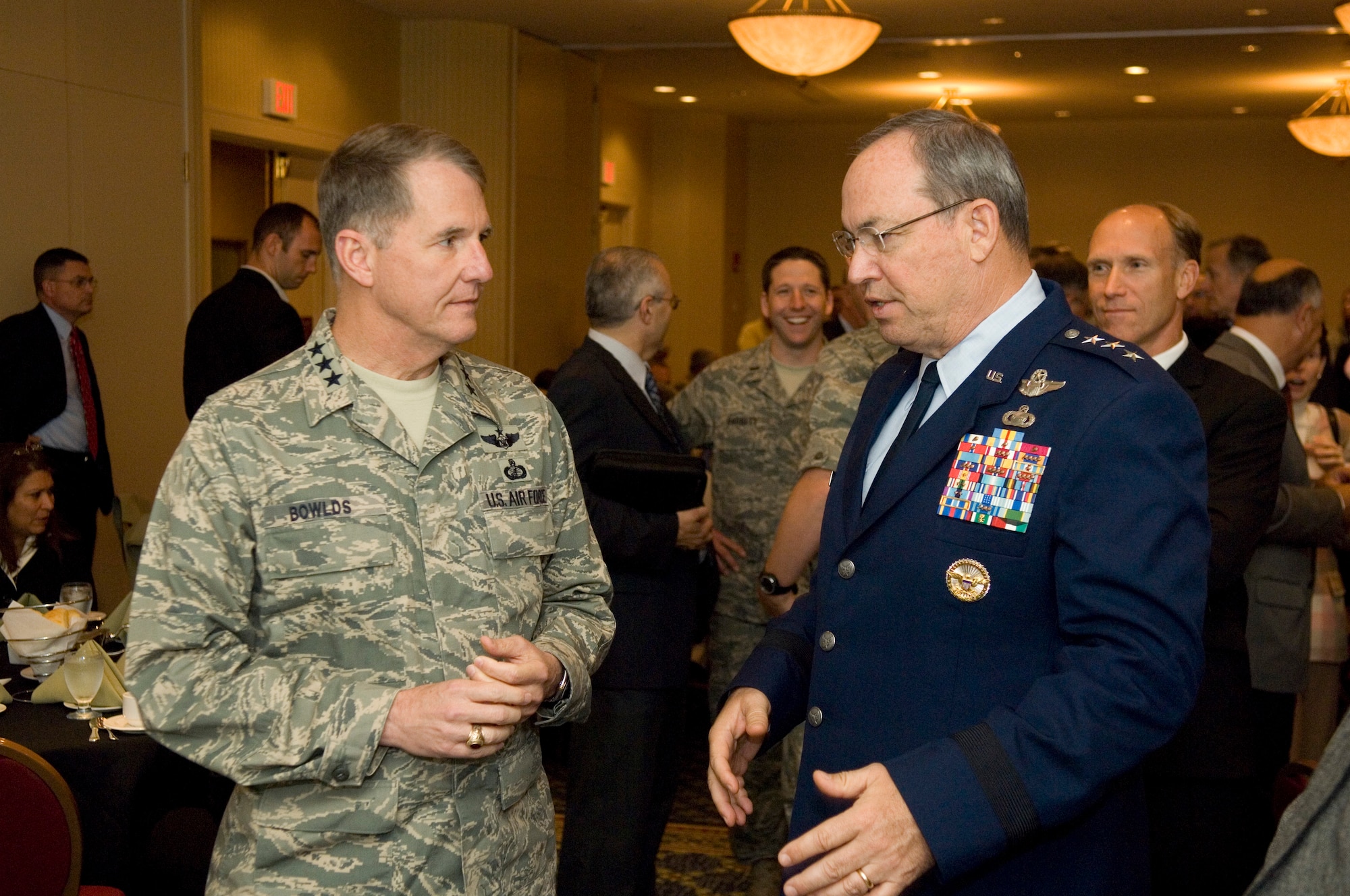 Lt. Gen. David Deptula (right), the Air Force deputy chief of staff for Intelligence, Surveillance and Reconnaissance, chats with Electronic Systems Center Commander Lt. Gen. Ted Bowlds during a June 10 forum near Hanscom AFB, Mass.  General Deptula later shared insights about key ISR challenges during a luncheon speech.  (USAF Photo by Rick Berry)