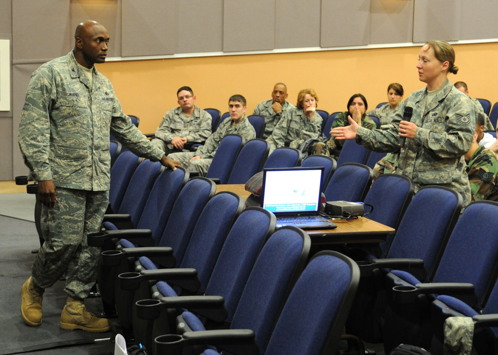 Col. Benjamin F. Ward, director of the Air Force Personnel Center, Randolph
Air Force Base, Texas, listens to questions from Tech. Sgt. Rebecca Janssen
from the 488th Intelligence Squadron, with concerns of special duty
assignments while married to military members, during the AFPC briefing at
the base theater June 10, 2009, at RAF Mildenhall, England. Col. Ward and
his team explained how many processes worked within AFPC and any changes to
come in the near future.  They also fielded questions from the audience on
any other concerns on personnel issues. (U.S. Air Force photo by Staff Sgt.
Jerry Fleshman)
