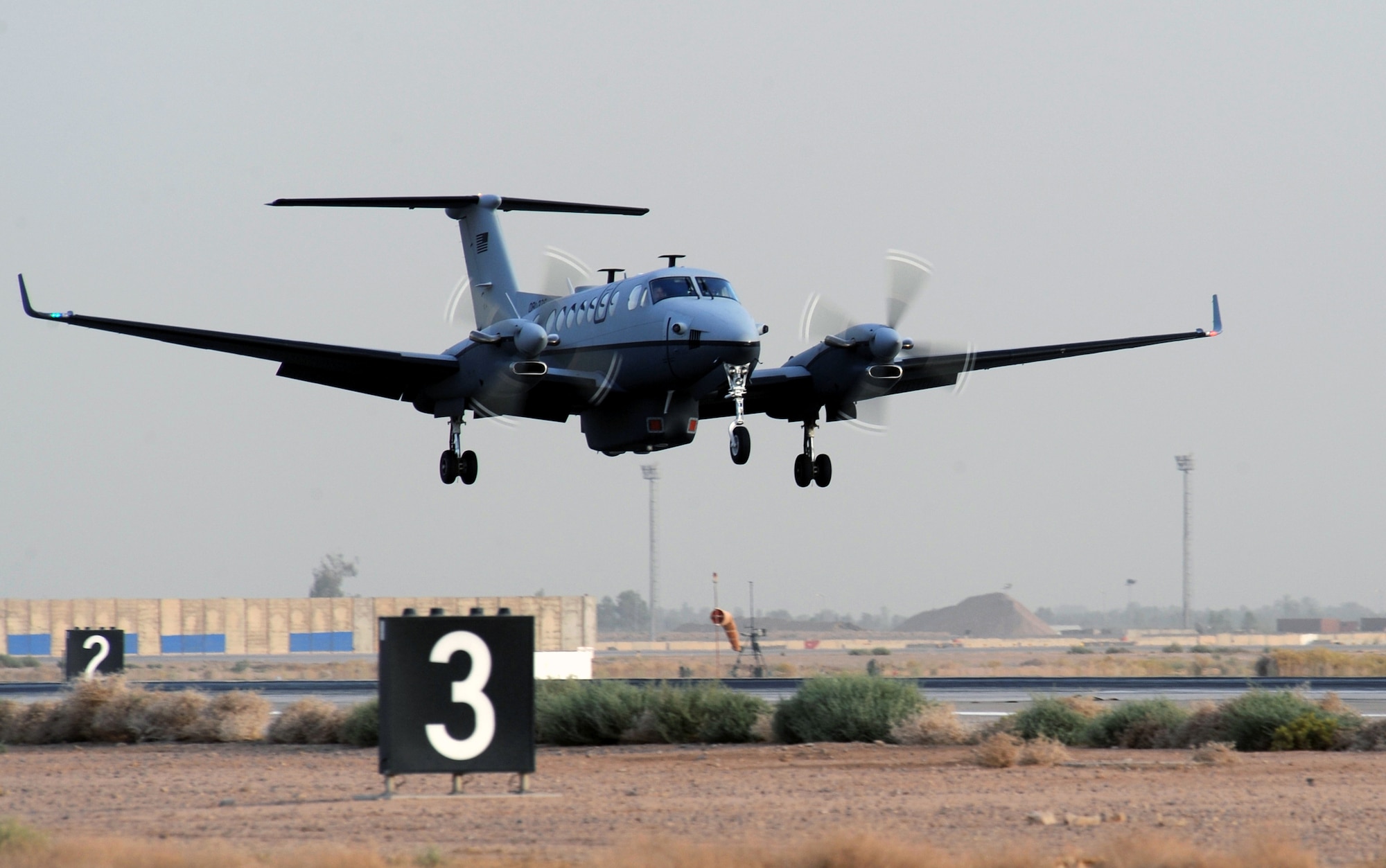 The first MC-12 aircraft in-theater lands after its first combat sortie at approximately 6:20 p.m. local time June 10 at Joint Base Balad, Iraq. The Air Force's newest intelligence, surveillance and reconnaissance platform, the MC-12 is a medium-altitude manned special-mission turbo prop aircraft that supports coalition and joint ground forces. (U.S. Air Force photo/Senior Airman Tiffany Trojca) 
