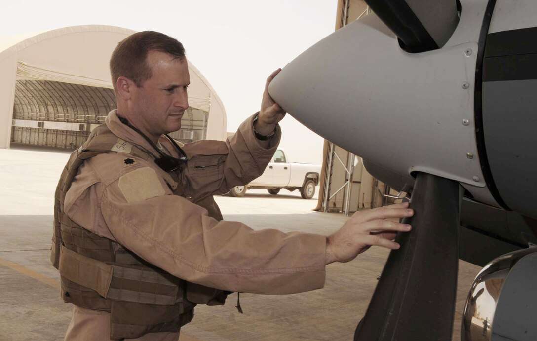Lt. Col. Phillip Stewart conducts a preflight inspection of an MC-12 Liberty prior to the aircraft's first combat sortie June 10 at Joint Base Balad, Iraq. A native of Silver Spring, Md., Colonel Stewart is the 362nd Expeditionary Reconnaissance Squadron commander and deployed from Langley Air Force Base, Va. (U.S. Air Force photo/Senior Airman Tiffany Trojca) 
