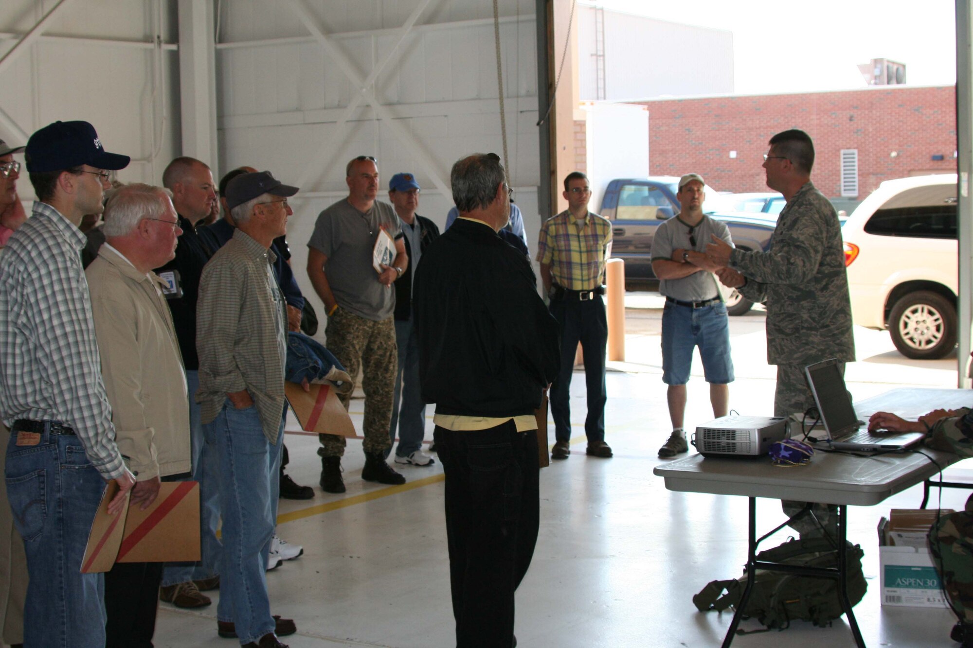 Maj. Charles Knapp, 911th Mission Support Flight Commander, briefs employers on what Airmen do when they process through a mobility line during mobilization. The employers were here during the June Unit Training Assembly as part of Employer's Day 2009. (photo by Staff Sgt. Roberto Modelo)
