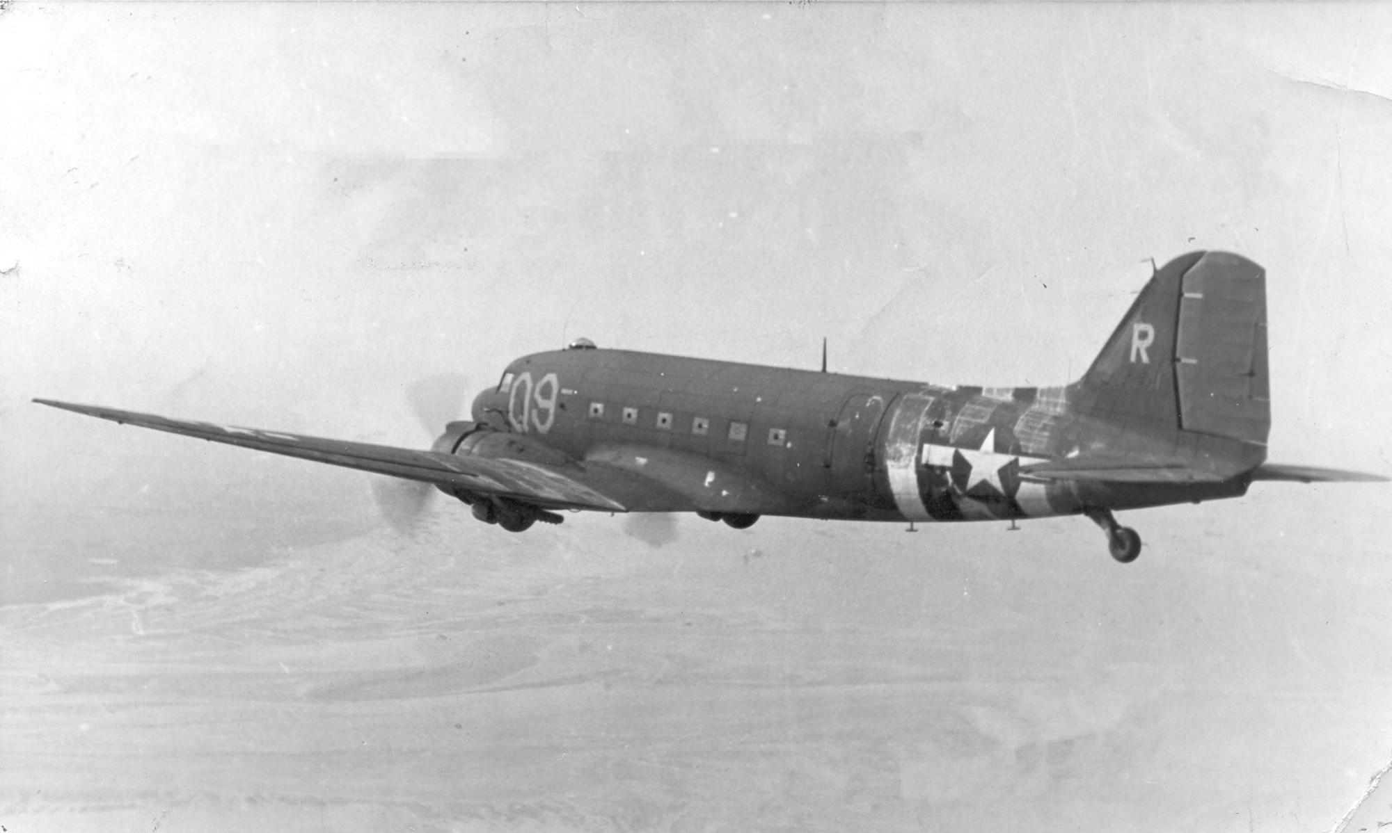 The Turf and Sport Special, a C-47 "Gooney Bird" aircraft, flies over Europe during World War II. This exact aircraft is currently on display at the Air Mobility Command Museum at Dover Air Force Base. (Courtesy photo)
