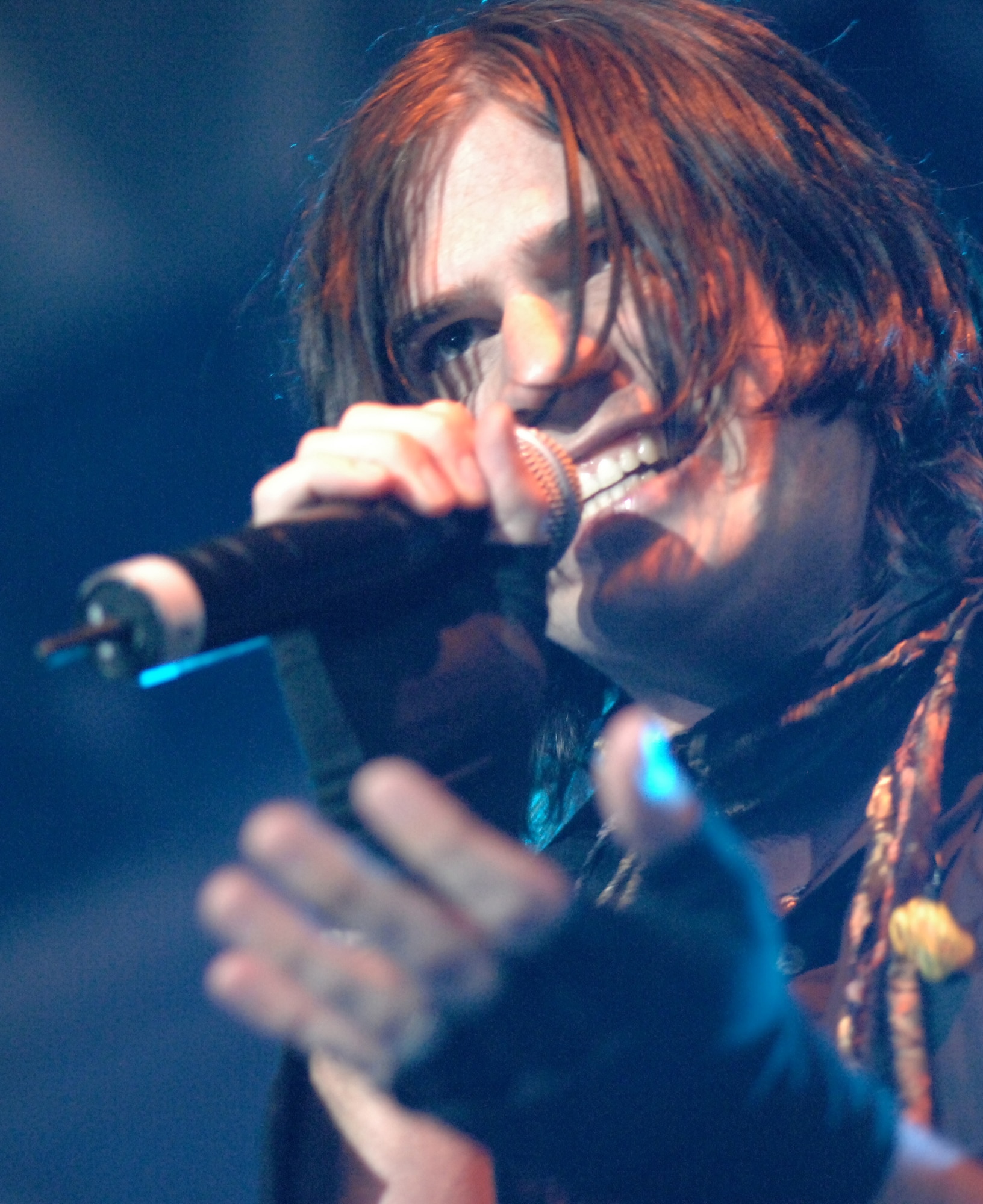 Austin Winkler, lead singer of the hard rock band Hinder, gives a spirited performance at RAF Mildenhall, June 9.  Hinder is a long time supporter of the military, and is performing six shows at different bases throughout Europe.  (U.S. Air Force photo by Staff Sgt. Christopher L. Ingersoll)