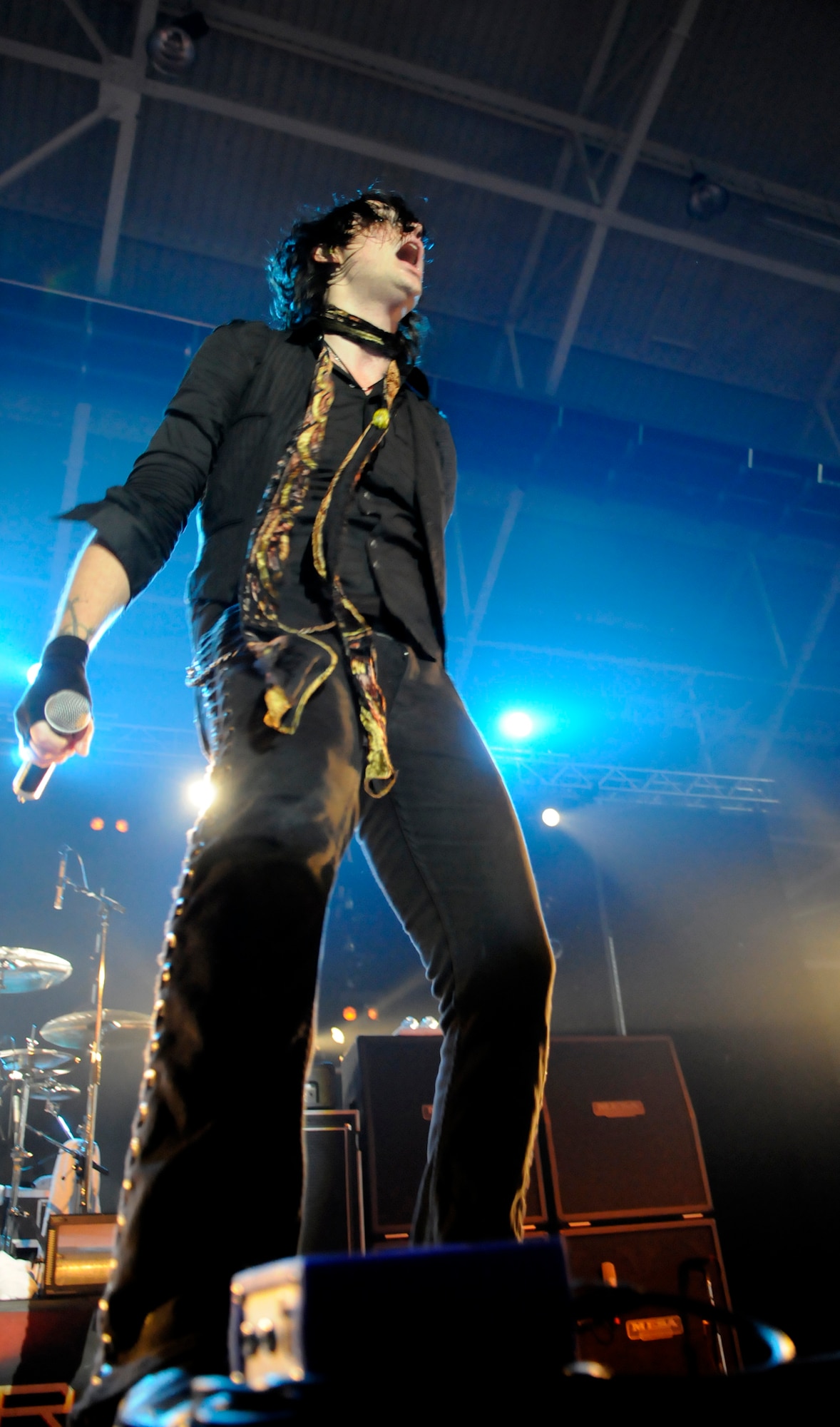 Austin Winkler, lead singer for the rock band Hinder, screams to a crowded audience during a performance sponsored by Armed Forces Entertainment and Navy Entertainment, on RAF Mildenhall, June 9.  The concert was part of a six-base European tour.  (U.S. Air Force photo by Staff Sgt. Christopher L. Ingersoll)