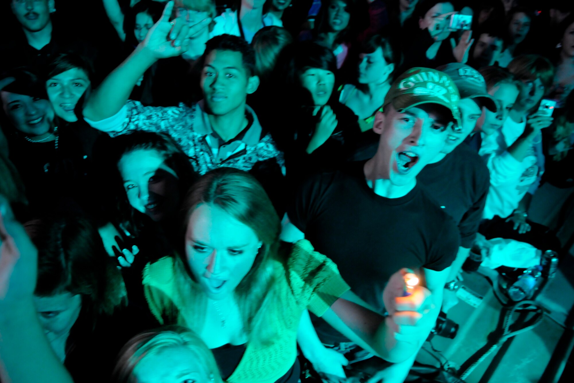 Audience members give a crazed shout during the Hinder concert at RAF Mildenhall, June 9.  The five-member rock band is touring six military installations sponsored by Navy Entertainment and Armed Forces Entertainment.  (U.S. Air Force photo by Staff Sgt. Christopher L. Ingersoll)