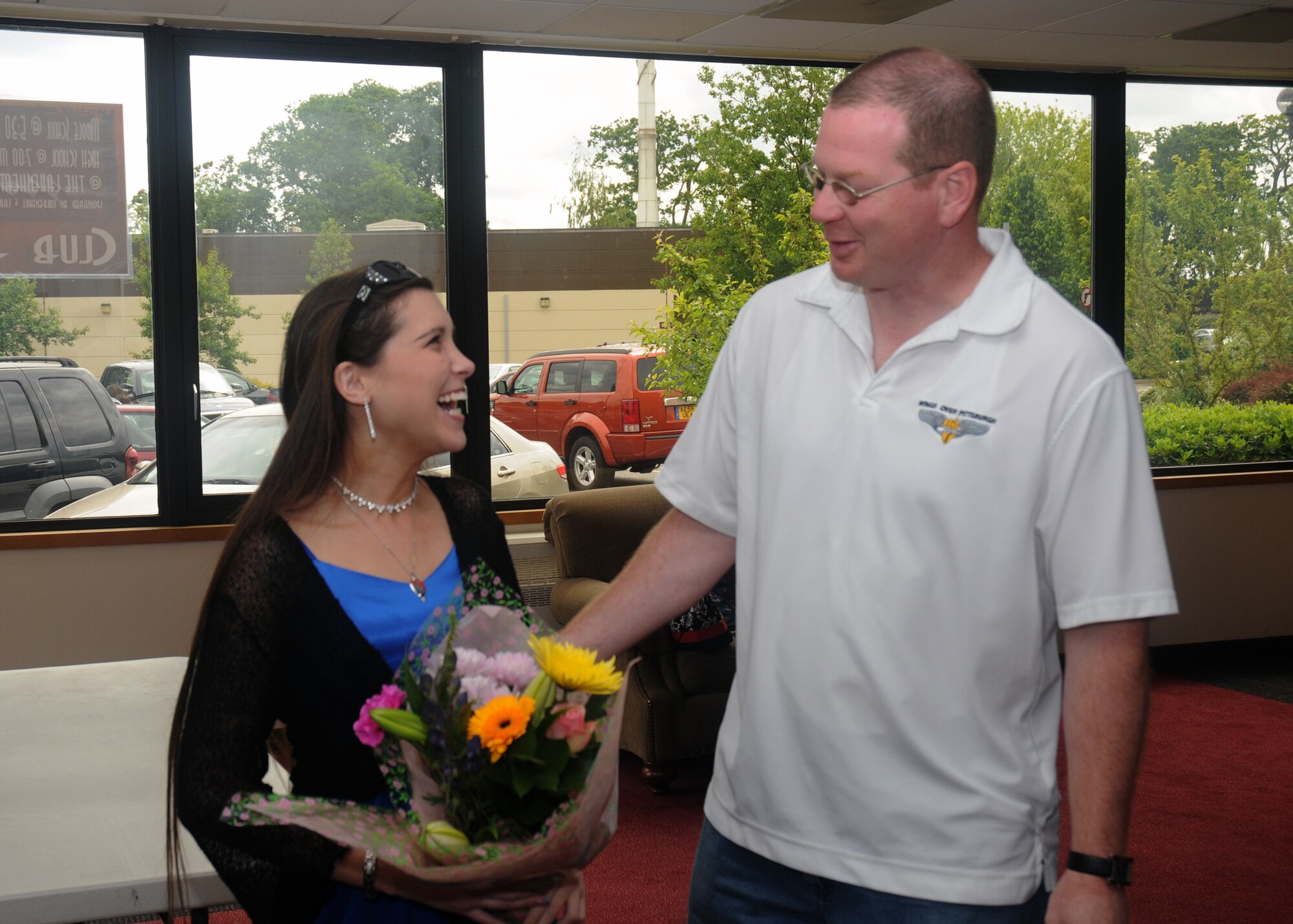 Kellie Schreiber is congratulated by Norm Long, 48th Force Support Squadron teen programs director after receiving word that she was awarded the European Command Youth of the Year Award. Miss Schreiber is the first RAF Lakenheath youth to attain this award and will now travel to New York to compete for the Boys and Girls Clubs of America’s Youth of the Year award. (U.S. Air Force photo by Senior Airman Kristopher Levasseur)