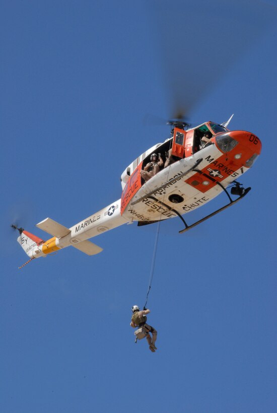Petty Officer 1st Class Jason Conley, Search and Rescue corpsman, rappels 100 feet onto the Auxiliary Airfield 2 from a HH-1N Huey at the Barry M. Goldwater Range in Yuma, Ariz., June 11, 2009. “It’s practice to rescue patients wherever they are,” said Cpl. Jeffrey Thomasson, SAR HH-1N crew chief.