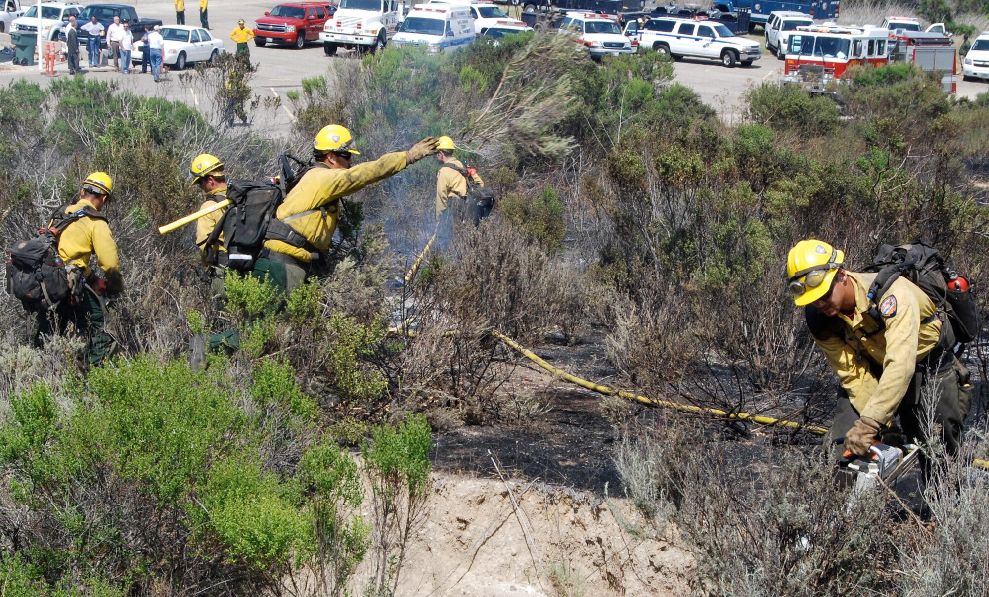 VANDENBERG AIR FORCE BASE, Calif. -- Vandenberg Hot Shots create a perimeter making sure no flare-ups occur behind them at the Lompoc Penitentiary Shooting Range near Vandenberg June 11.  Due to the fact that California is in the middle of its fire season, a large amount of resources responded from Vandenberg, Lompoc and Santa Barbara County to extinguish the flames. (Photo by Andrew Klein)