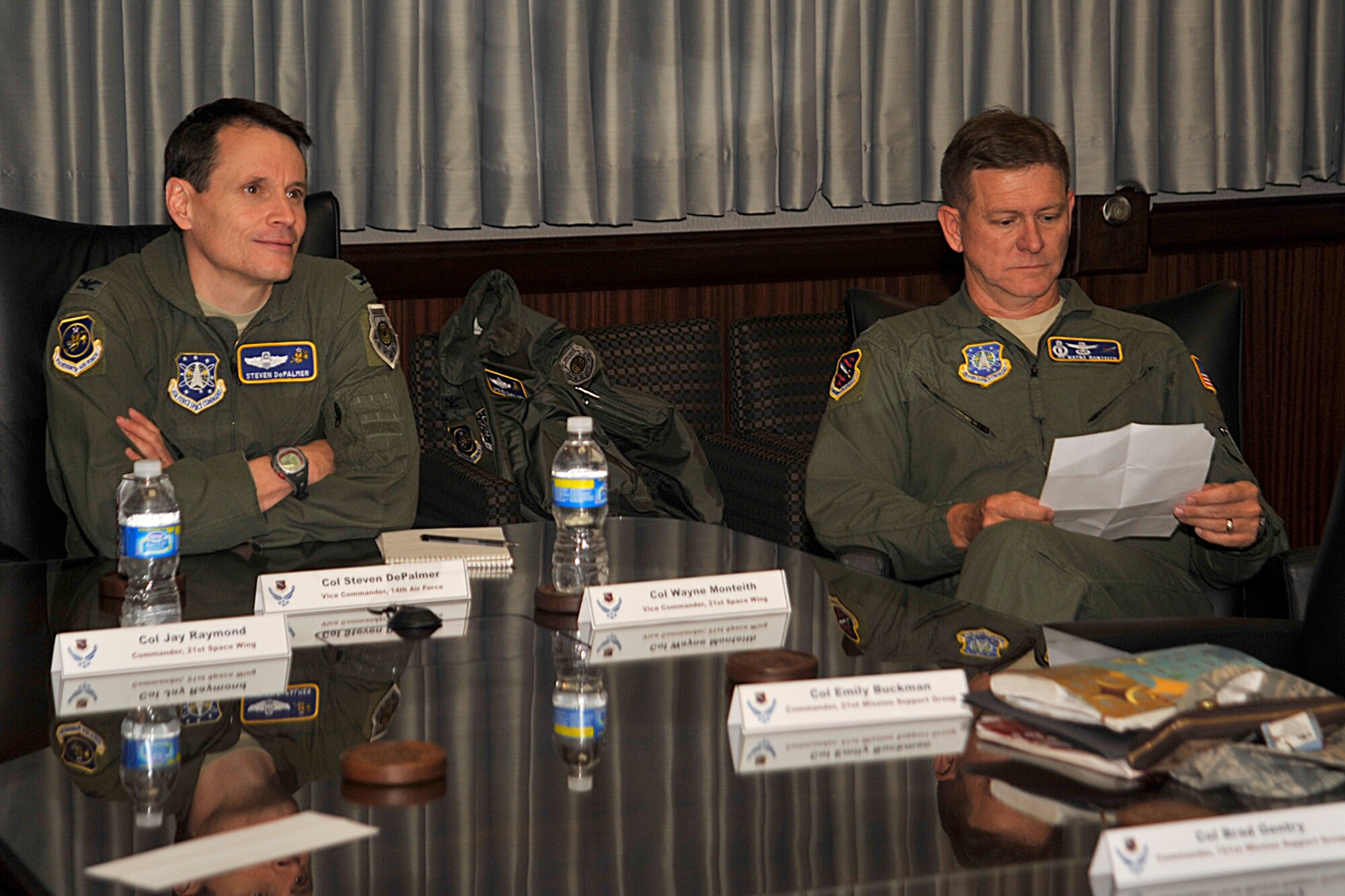 Col. Steven DePalmer (left), 14th Air Force vice commander, visited the 21st Space Wing June 10 as part of his mission orientation hosted by Col. Jay Raymond, 21st SW commander, and Col. Wayne Monteith (right), 21st SW vice commander. Colonel DePalmer visited the 16th and 76th Space Control Squadrons, Cheyenne Mountain Air Force Station and Peterson, where he received a tour of the wing’s new housing area. (Air Force photo by Robb Lingley)