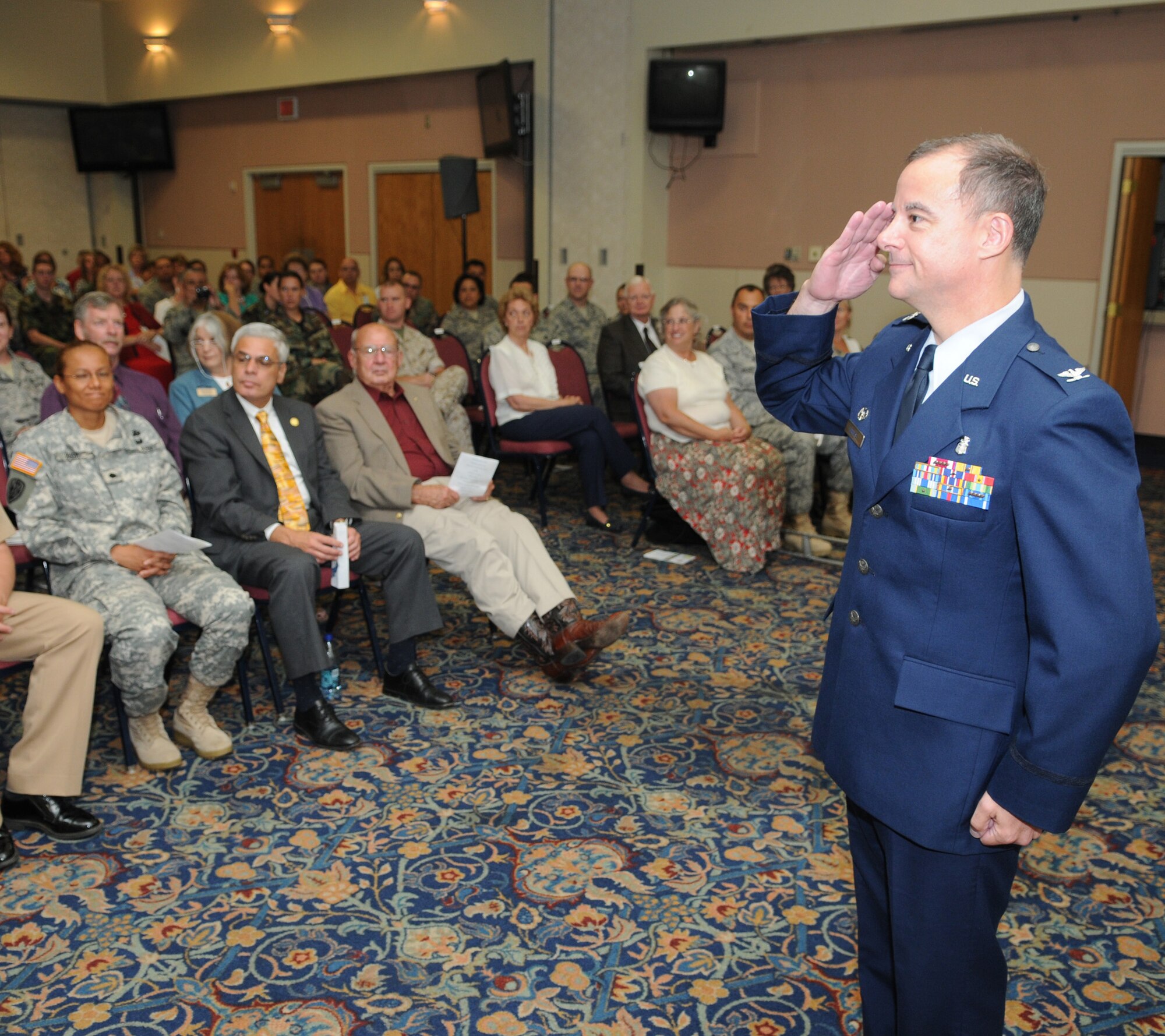 Colonel (Doctor) James Forrest, 17th Medical Group commander, salutes his Airmen after assuming command June 5. Colonel Forrest joins Team Goodfellow from Royal Air Force Lakenheath, United Kingdom, and has served in the Air Force for 24 years. (U.S. Air Force photo by Tech. Sgt. John Barton)