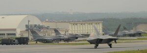 LANGLEY AIR FORCE, Va. -- An F-22A Raptor taxis before takeoff at Kadena Air Base, Japan, June 2. More than 280 Langley Airmen and 12 of the Air Force’s most capable fighters successfully deployed to as part of a theater security package sent to the Western Pacific.  (U.S. Air Force photo/Airman 1st Class Jarrod Chavana)
