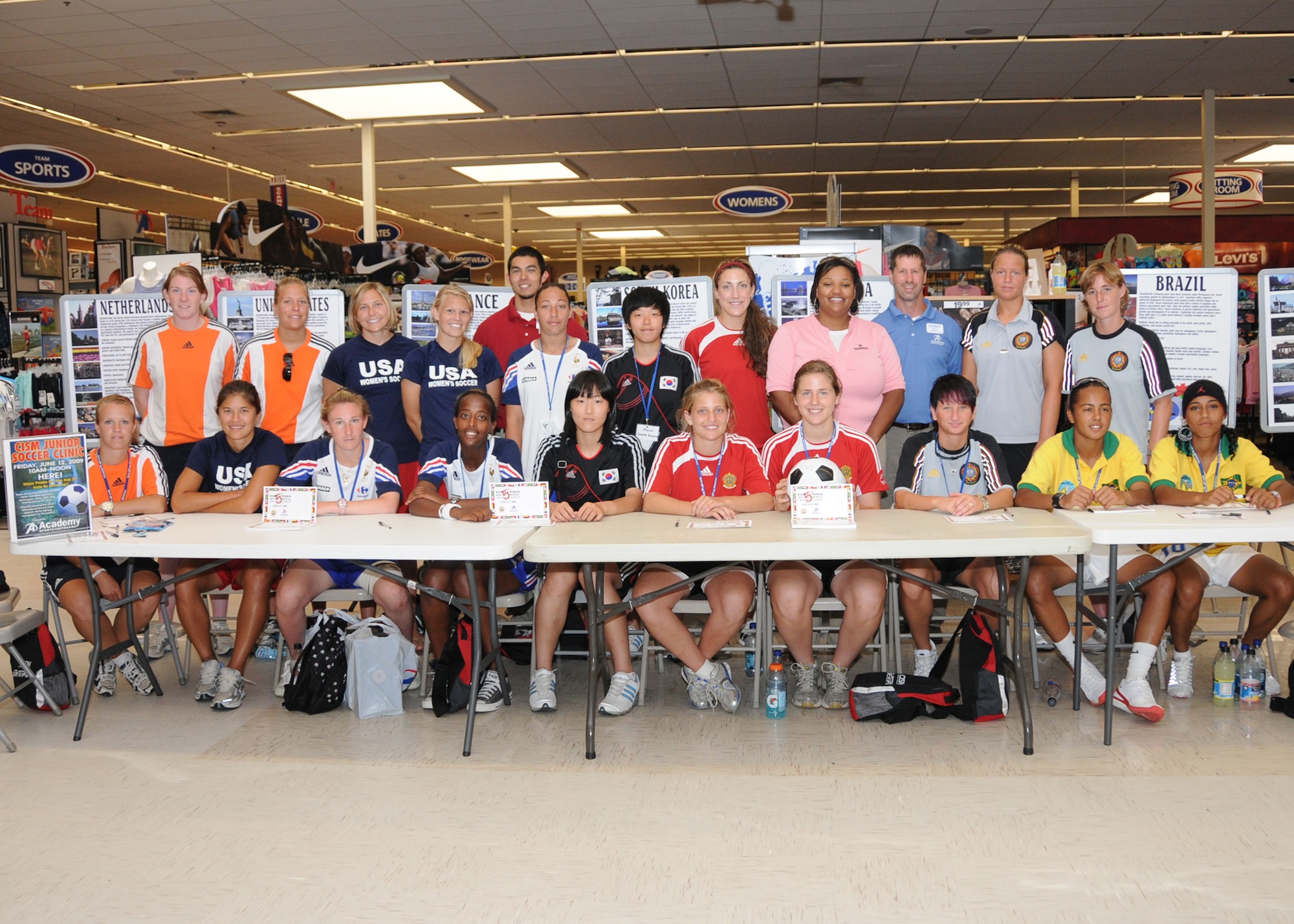 Members from teams attending the the 5th CISM Women’s Soccer Championship, hosted by Keesler Air Force base, sign autographs and participate in sport clinics June 12 at the soccer field on base and Academy Sports. Teams from Brazil, Canada, France, Germany, The Netherlands, The Republic of South Korea and The United States attended the clinics and autograph sessions and demonstrated some fundamentals of soccer.  (U.S. Air Force photo by Kemberly Groue)