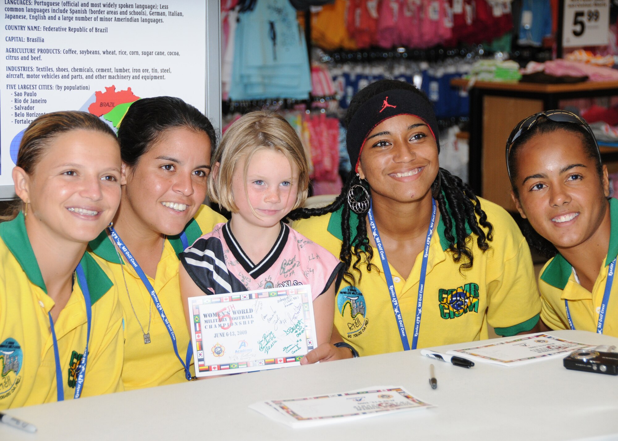 Members from teams attending the the 5th CISM Women’s Soccer Championship, hosted by Keesler Air Force base, sign autographs and participate in sport clinics June 12 at the soccer field on base and Academy Sports. Teams from Brazil, Canada, France, Germany, The Netherlands, The Republic of South Korea and The United States attended the clinics and autograph sessions and demonstrated some fundamentals of soccer.  (U.S. Air Force photo by Kemberly Groue)