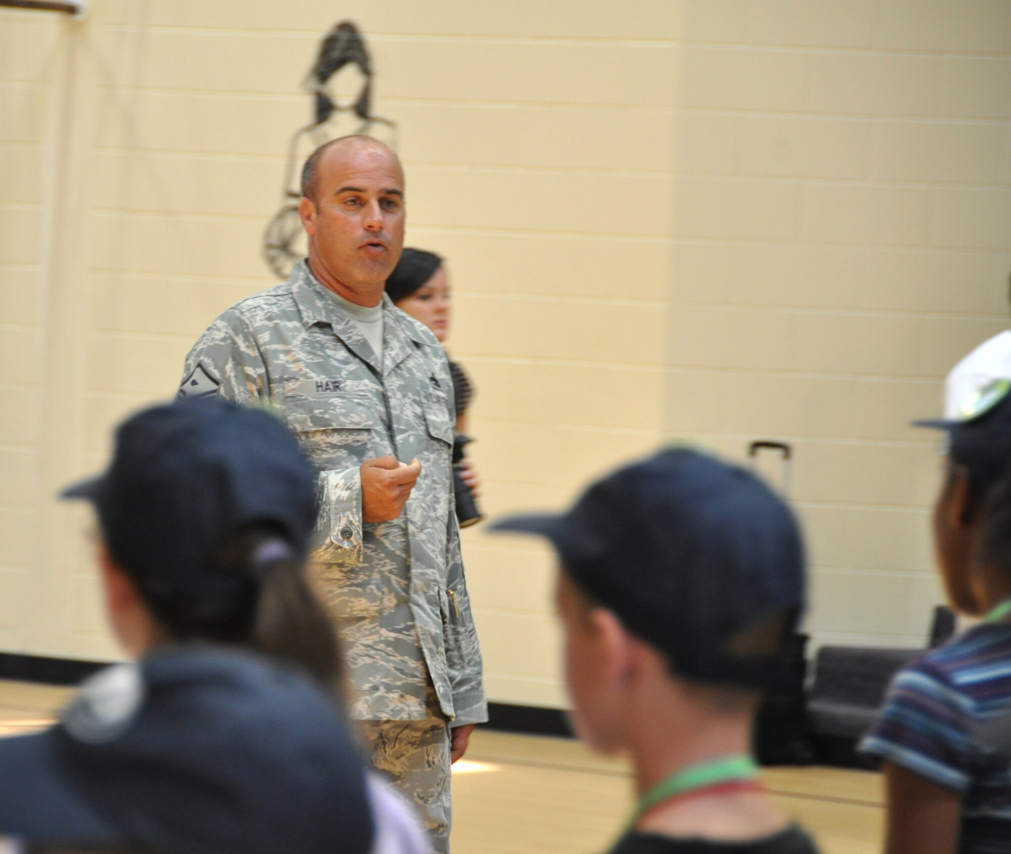 (Left center) Master Sgt. Michael Hair, 325th Force Support Squadron first sergeant, provides information to his "troops" for their "deployment" June 12 at Tyndall Air Force Base, Fla as part of the Operation Junior R.A.P.T.O.R. program. The purpose of the day was to give children an idea of what their military parents have to do when deploying abroad; the event was sponsored by the Airman and Family Readiness Center. (U.S. Air Force photo/Staff Sgt. Joshua Stevens)