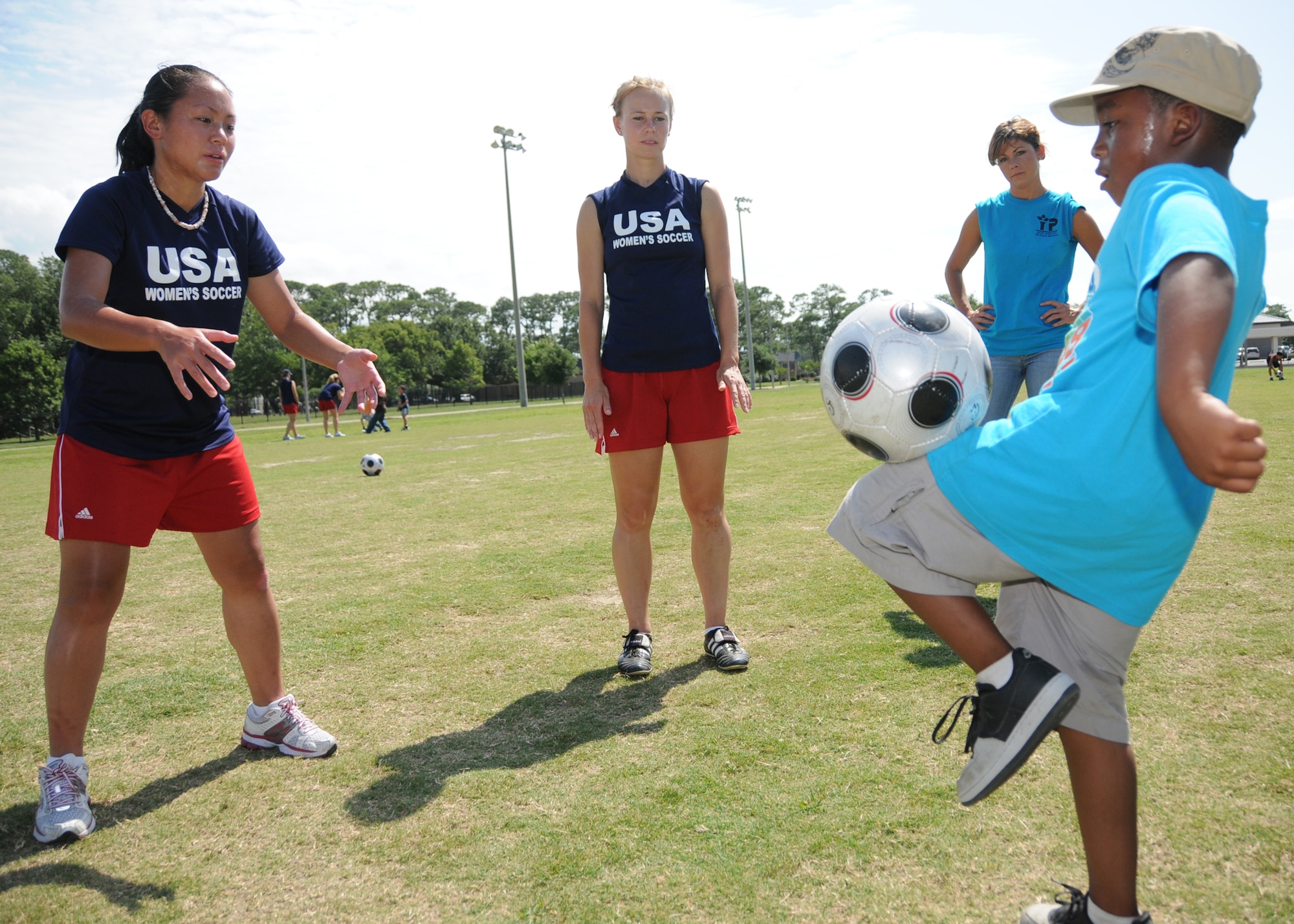 Members from teams attending the the 5th CISM Women’s Soccer Championship, hosted by Keesler Air Force base, sign autographs and participate in sport clinics June 12 at the soccer field on base and Academy Sports. Teams from Brazil, Canada, France, Germany, The Netherlands, The Republic of South Korea and The United States attended the clinics and autograph sessions and demonstrated some fundamentals of soccer.  (U.S. Air Force photo by Kemberly Groue)