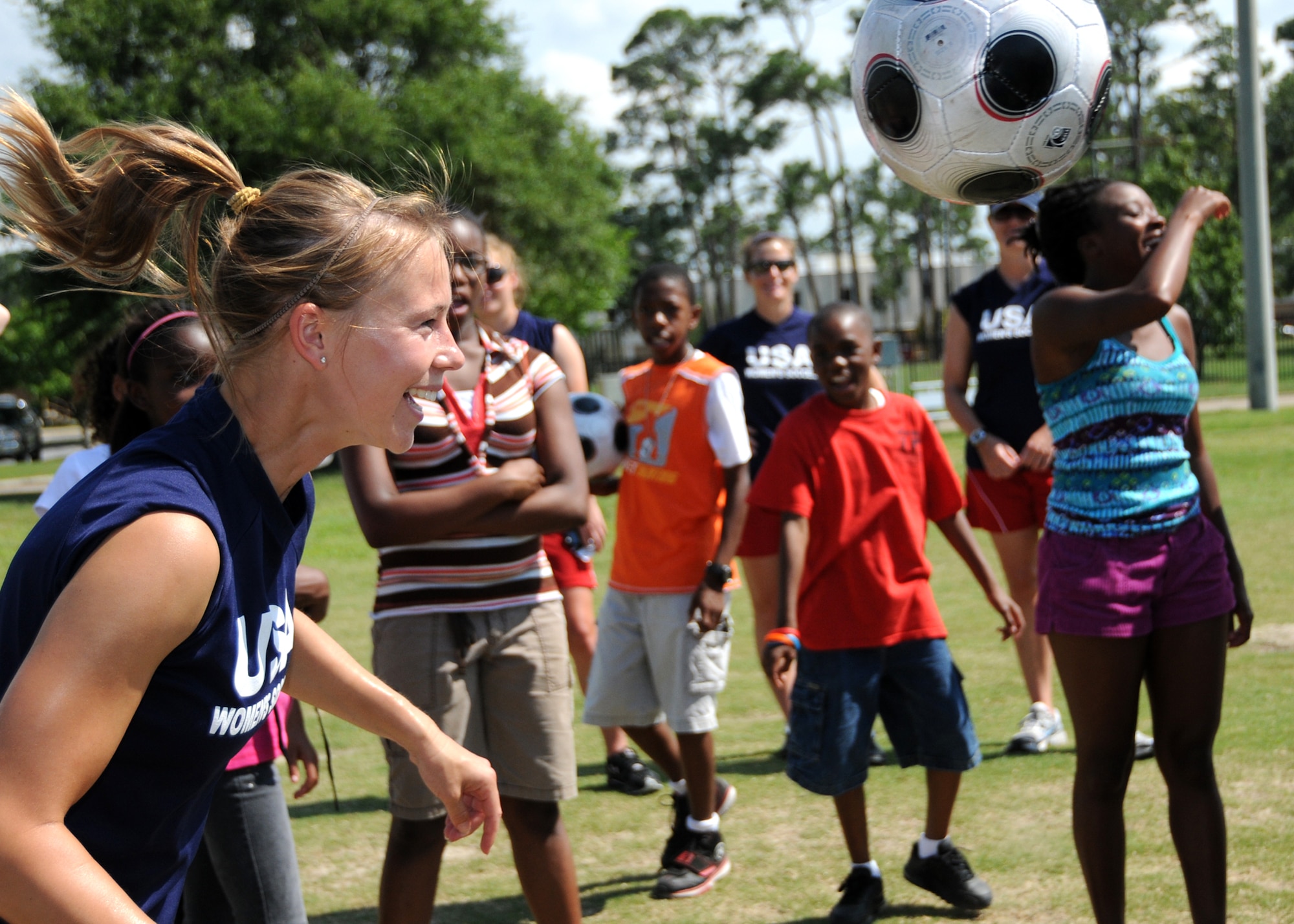 Members from teams attending the the 5th CISM Women’s Soccer Championship, hosted by Keesler Air Force base, sign autographs and participate in sport clinics June 12 at the soccer field on base and Academy Sports. Teams from Brazil, Canada, France, Germany, The Netherlands, The Republic of South Korea and The United States attended the clinics and autograph sessions and demonstrated some fundamentals of soccer.  (U.S. Air Force photo by Kemberly Groue)