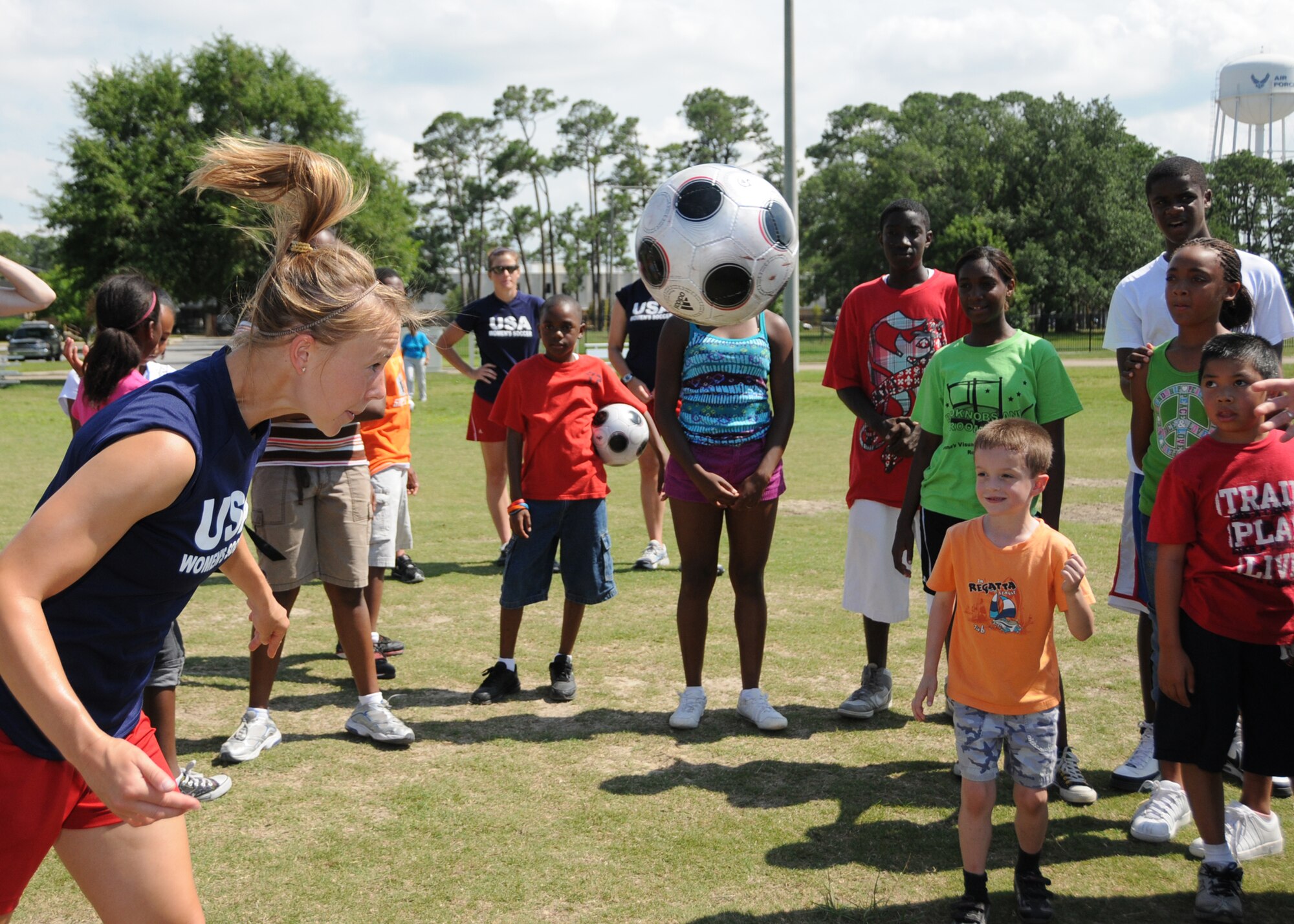 Members from teams attending the the 5th CISM Women’s Soccer Championship, hosted by Keesler Air Force base, sign autographs and participate in sport clinics June 12 at the soccer field on base and Academy Sports. Teams from Brazil, Canada, France, Germany, The Netherlands, The Republic of South Korea and The United States attended the clinics and autograph sessions and demonstrated some fundamentals of soccer.  (U.S. Air Force photo by Kemberly Groue)
