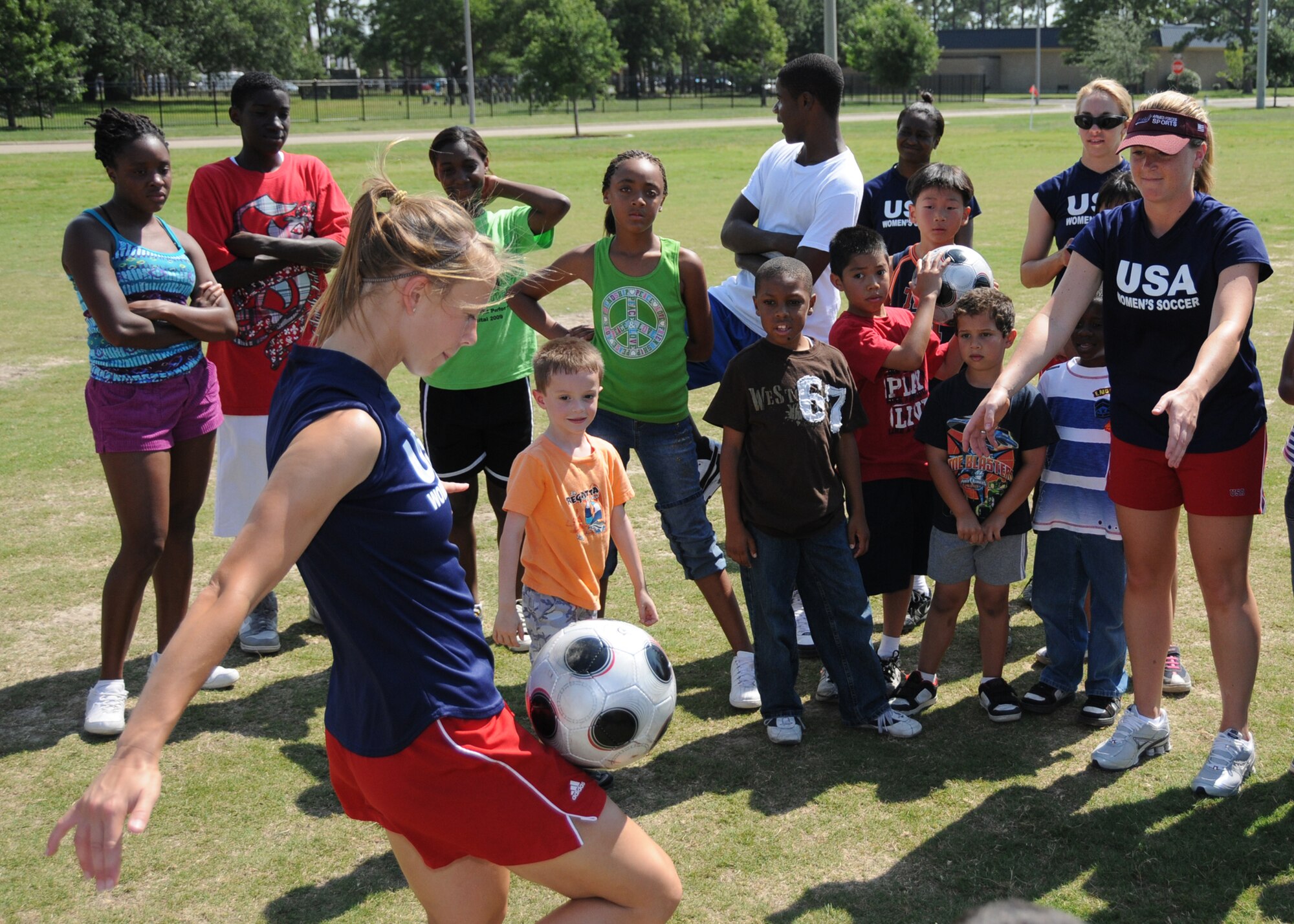 Members from teams attending the the 5th CISM Women’s Soccer Championship, hosted by Keesler Air Force base, sign autographs and participate in sport clinics June 12 at the soccer field on base and Academy Sports. Teams from Brazil, Canada, France, Germany, The Netherlands, The Republic of South Korea and The United States attended the clinics and autograph sessions and demonstrated some fundamentals of soccer.  (U.S. Air Force photo by Kemberly Groue)