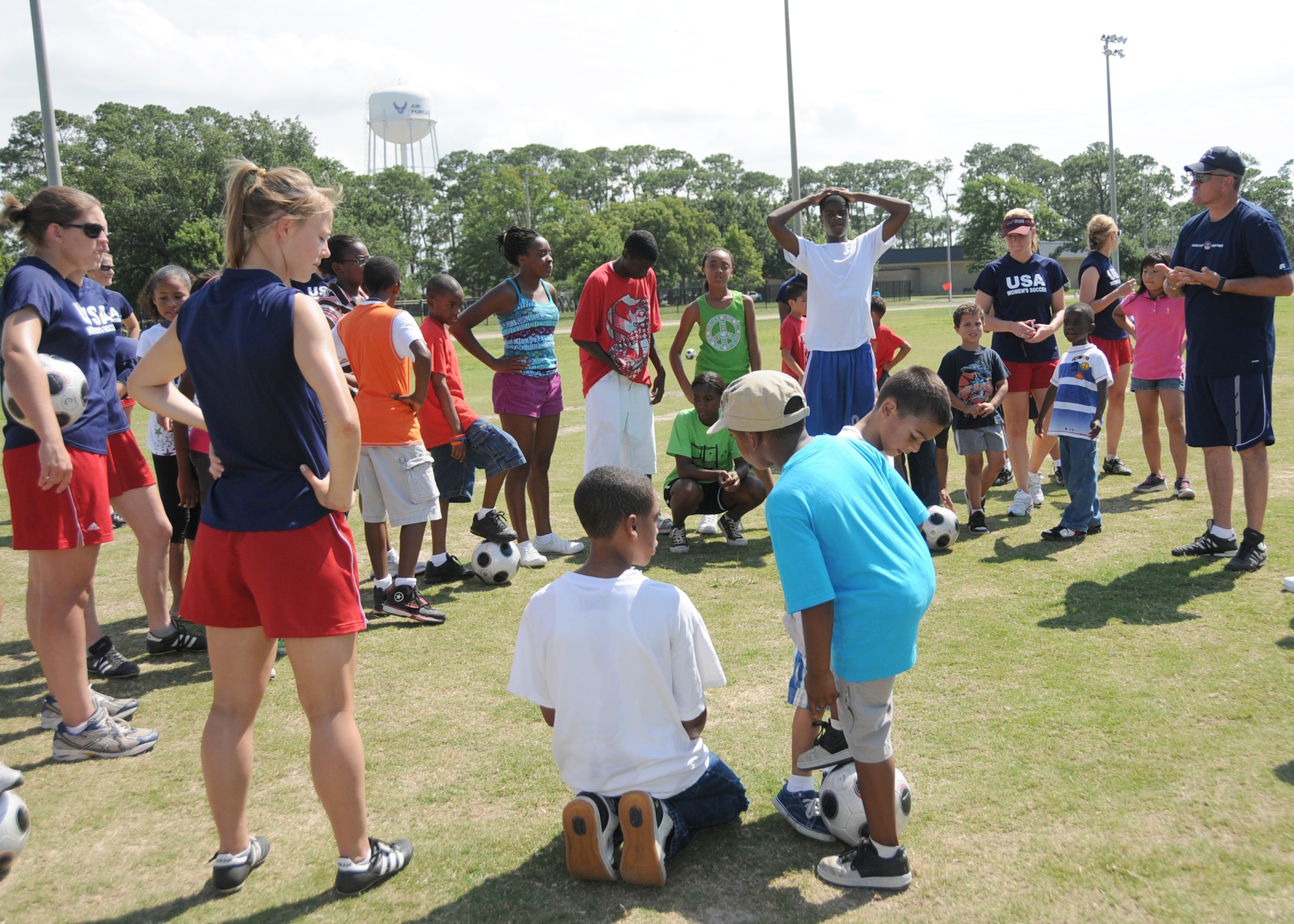 Members from teams attending the the 5th CISM Women’s Soccer Championship, hosted by Keesler Air Force base, sign autographs and participate in sport clinics June 12 at the soccer field on base and Academy Sports. Teams from Brazil, Canada, France, Germany, The Netherlands, The Republic of South Korea and The United States attended the clinics and autograph sessions and demonstrated some fundamentals of soccer.  (U.S. Air Force photo by Kemberly Groue)