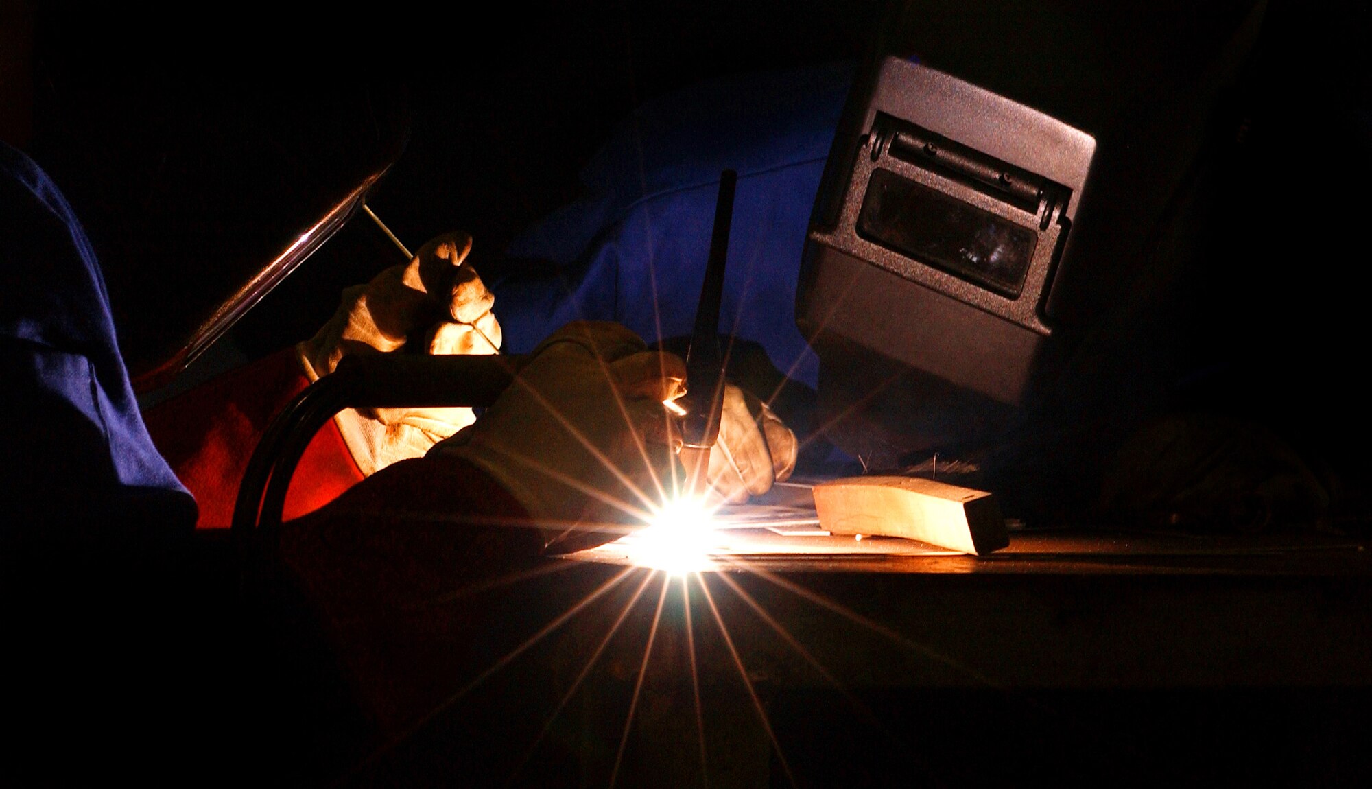 Airmen and local nationals practice oxyacetylene welding June 4 at Kadena Air Base, Japan. The process uses fuel gases and oxygen to cut and weld metals. Personnel from vehicle mechanics and body shop are completing a newly implemented welding course at the Pacific Air Forces Transportation Training Center. (U.S. Air Force photo/Tech. Sgt. Rey Ramon)                                                       