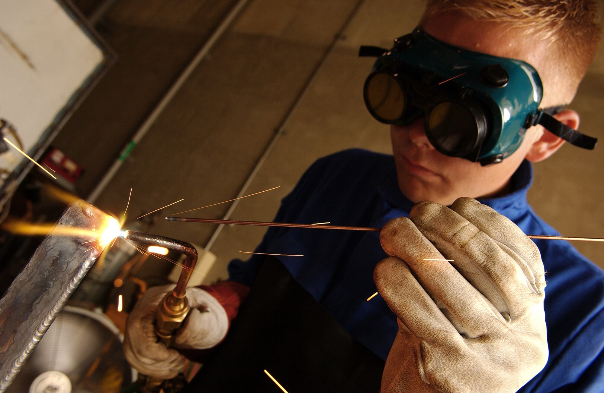 Senior Airman Christopher Swenson, 18th Logistics Readiness Squadron vehicular equipment maintenance journeyman, practices shielded metal arc welding June 4 at Kadena Air Base, Japan. Personnel from vehicle mechanics and body shop are completing a newly implemented welding course at the Pacific Air Forces Transportation Training Center. (U.S. Air Force photo/Tech. Sgt. Rey Ramon)  
                                                  