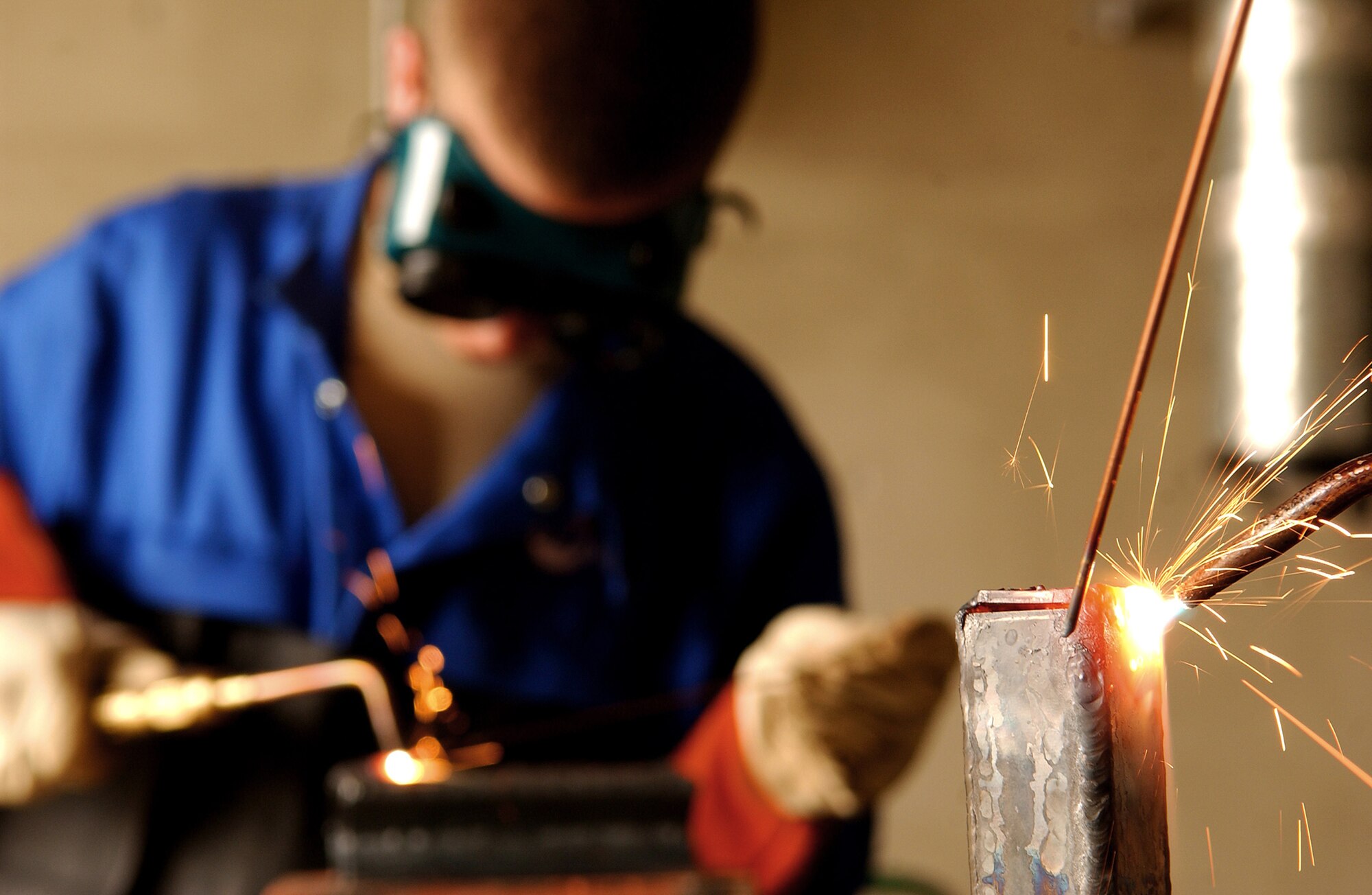 Airmen and local nationals practice shielded metal arc welding June 4 at Kadena Air Base, Japan. Personnel from vehicle mechanics and body shop are completing a newly implemented welding course at the Pacific Air Forces Transportation Training Center. (U.S. Air Force photo/Tech. Sgt. Rey Ramon)                                                       