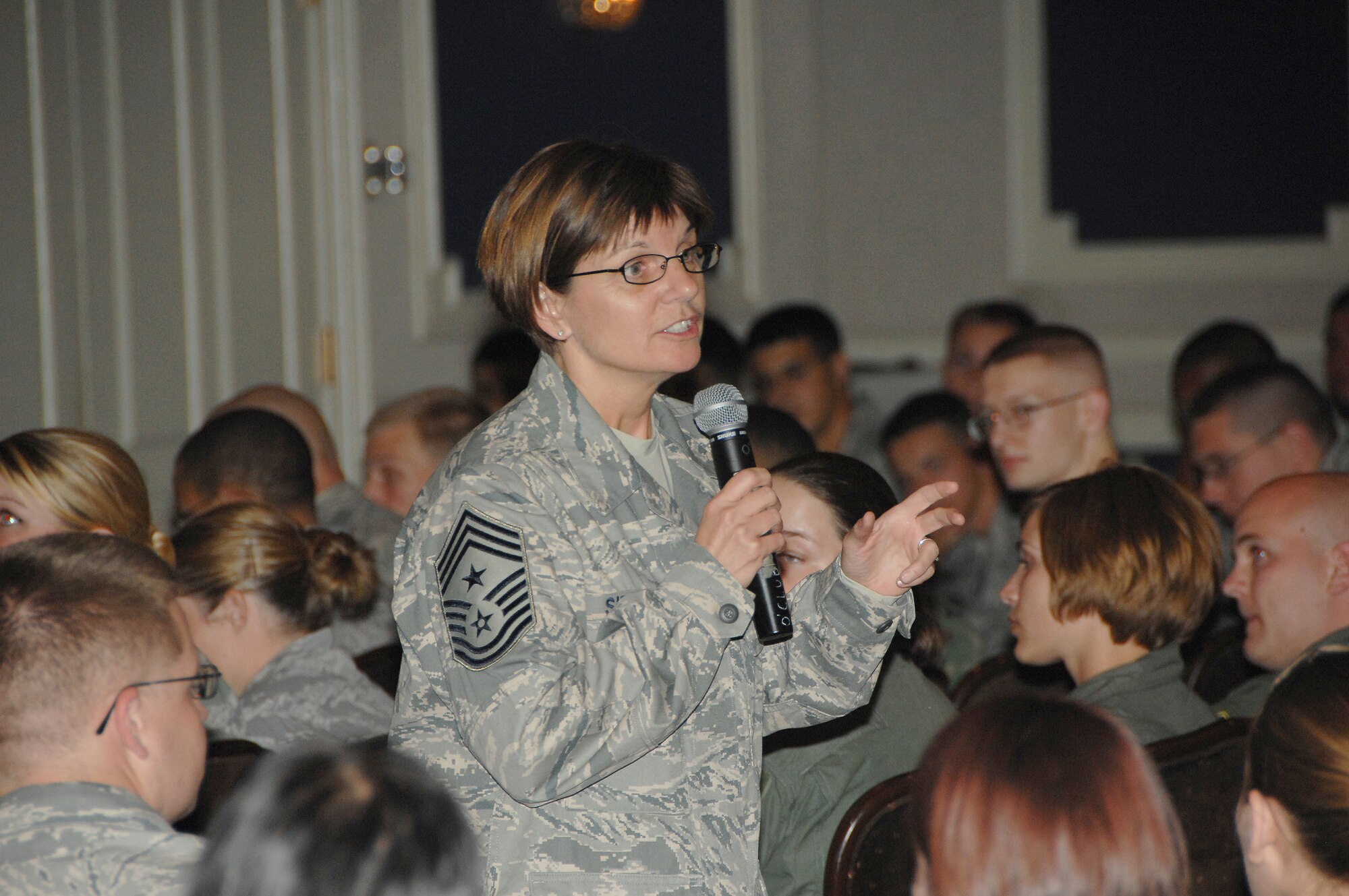 OFFUTT AIR FORCE BASE, Neb. -- 55th Wing Command Chief Master Sgt. Lisa Sirois speaks to Offutt Airmen during an enlisted call at the Patriot Club June 10. Enlisted calls are one of many avenues for wing leadership to inform unit members and receive feedback. 
Air Force Photo by D. P. Heard