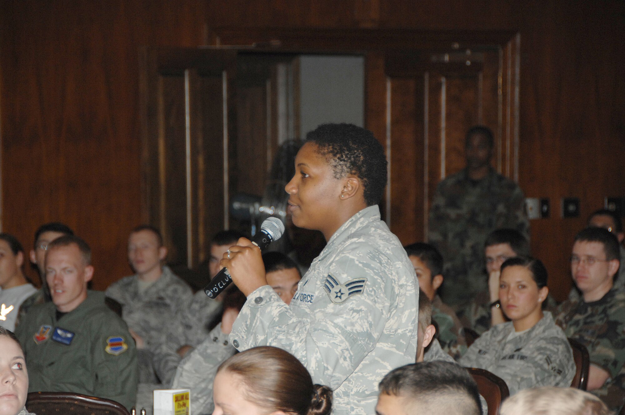 OFFUTT AIR FORCE BASE, Neb. -- Senior Airman Mercedes N. Hill, 55 Force Support Squadron, poses an question to the 55th Wing command chief during an enlisted call at the Patriot Club June 10. Enlisted calls are one of many avenues for wing leadership to inform unit members and receive feedback. 

Air Force Photo by Dana P. Heard