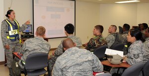 LANGLEY AIR FORCE BASE, Va. -- 1st Lt. Krista Barajas, 1st Force Support Squadron section commander, briefs Airmen during an Operational Readiness Exercise pre-deployment briefing June 12. The June 2009 Phase I ORE was conducted to test and prepare Langley Airmen for future deployments. (U.S. Air Force photo/Airman 1st Class Gul Crockett)