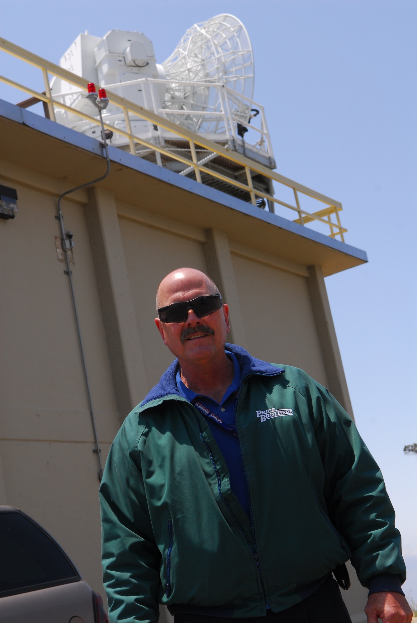 VANDENBERG AIR FORCE BASE, Calif. – Rod Kennedy, an Indyne radar department manager, stands before a two-story building used to anchor the FPS-16 Radar here June 9.  The radar is used to provide data and track missiles during launches. This radar, along with its data system, will be tracking the upcoming June 29 Minuteman III launch to direct the missile and ensure its direction is not altered. (U.S. Air Force photo/Airman 1st Class Steve Bauer)