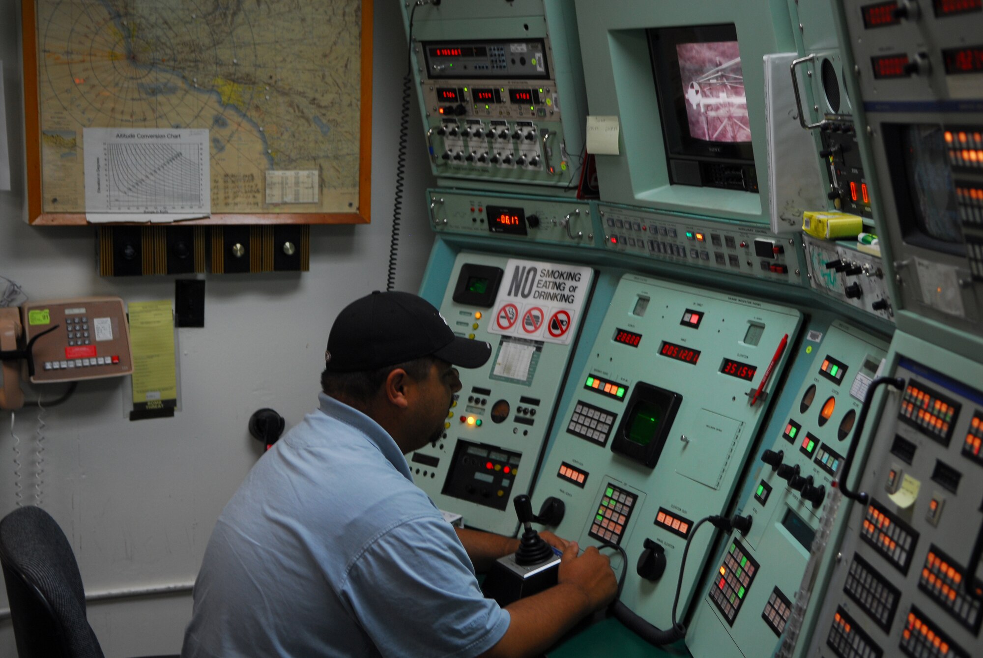 VANDENBERG AIR FORCE BASE, Calif. – Manning a control panel that dates back more than 50 years, Salvador Sanchez, contractor for Western Range Operations Communications and Information, operates the FPS-16 Radar here June 9. The radar is used to provide data and track missiles during launches. This radar, along with its data system, will be tracking the upcoming June 29 Minuteman III launch to direct the missile and ensure its direction is not altered. (U.S. Air Force photo/Airman 1st Class Steve Bauer)