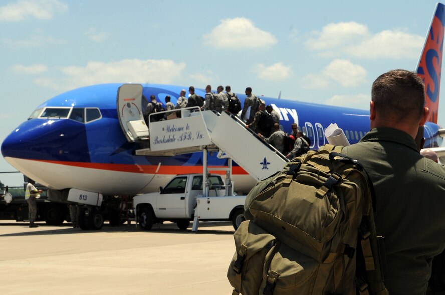 Airmen from Barksdale board the Sun Country Boeing 737-8Q8 in preparation for Northern Edge 2009. Northern Edge is Alaska's largest military training exercise. The exercise is held over a two-week period, beginning June 11. Due to the exercise more than 50 additional aircraft will be flying to Eielson and more than 100 more throughout Alaska. (U.S. Air Force photo by Airman 1st Class Brittany Y. Bateman)

