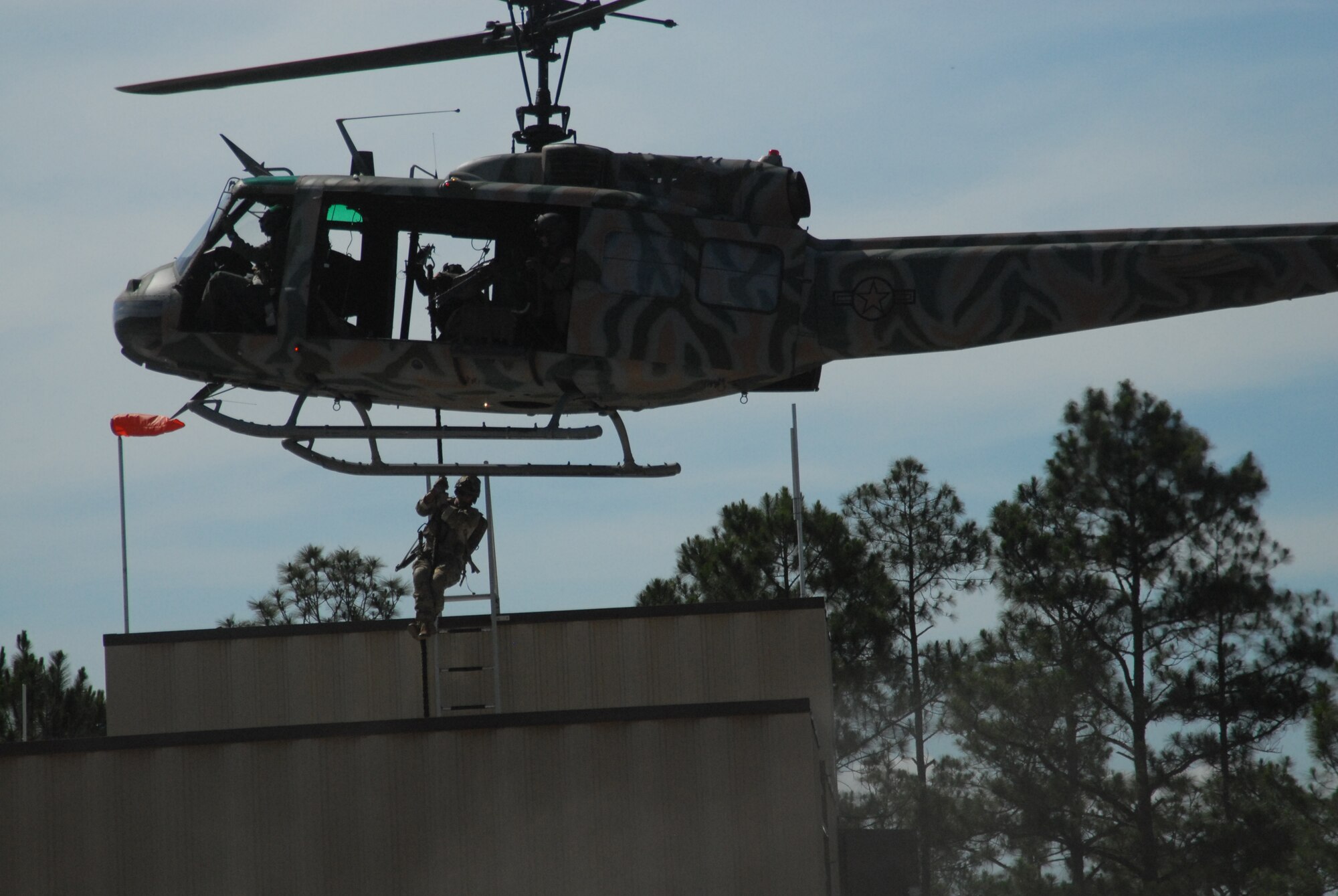Hurlburt Field, Fla.-- Members of a special operations unit infil on a buliding during a demonstration for the ribbon cutting ceremony of the SERE Urban and Integrated Urban Joint Close Air Support Target Sets, Jun 8. (U.S. Air Force photo by Staff Sgt. Orly N. Tyrell).