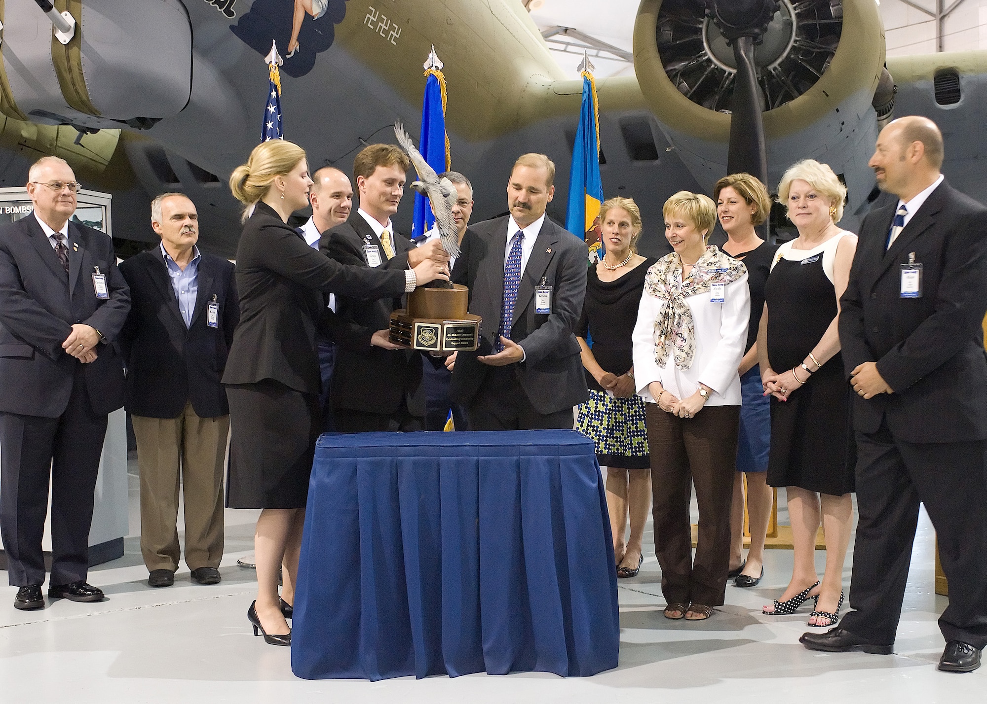 (Left to right) Kristina Jones and Gray Bridwell, Abilene Chamber of Commerce Military Affairs Executive Committee members, present the Abilene Trophy to Dean Blaha, Central Delaware Chamber of Commerce Military Affairs Committee chairman, and Judy Diogo, CDCC president, June 10 at the Air Mobility Command Museum. The CDCC received the Abilene Trophy for winning the 2009 AMC Community Support Award, which is presented annually to a civilian community for outstanding support to a nearby AMC base. (U.S. Air Force Photo/Tom Randle)