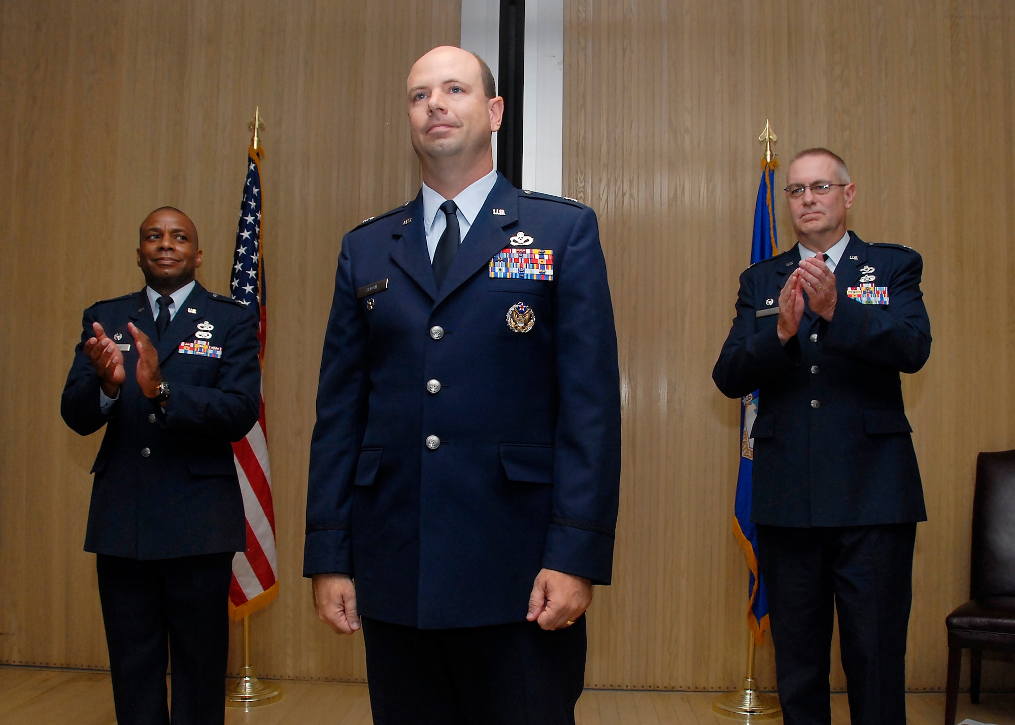 Col. Tony Pounds, 782nd Training Group commander, and Lt. Col. Matthew Bobb, outgoing commander of the 366th Training Squadron, welcomes Lt. Col. Mark Sloan, incoming 366th TRS commander, at the change of command ceremony June 11. (U.S. Air Force photo/Harry Tonemah)