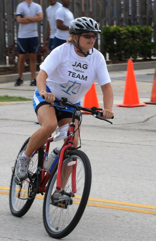 Melinda Redwing from the Staff Judge Advocate’s office pedals her way during the team Triathlon event on Sports Day June 5. (U.S. Air Force photo/Cesar Rodriguez)
