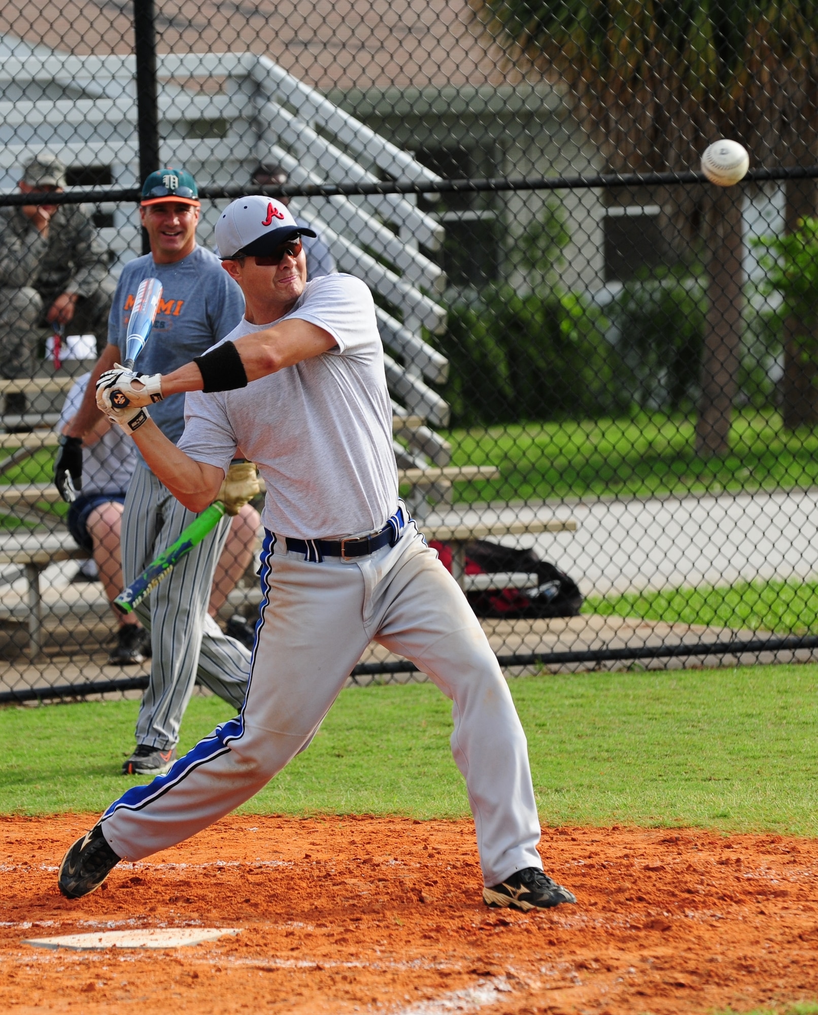 Maj. Gary Benton of the Air Force Technical Applications Center takes a hefty home-run swing during the one-pitch softball tournament on Sports Day June 5. (U.S. Air Force photo/Jennifer Macklin)
