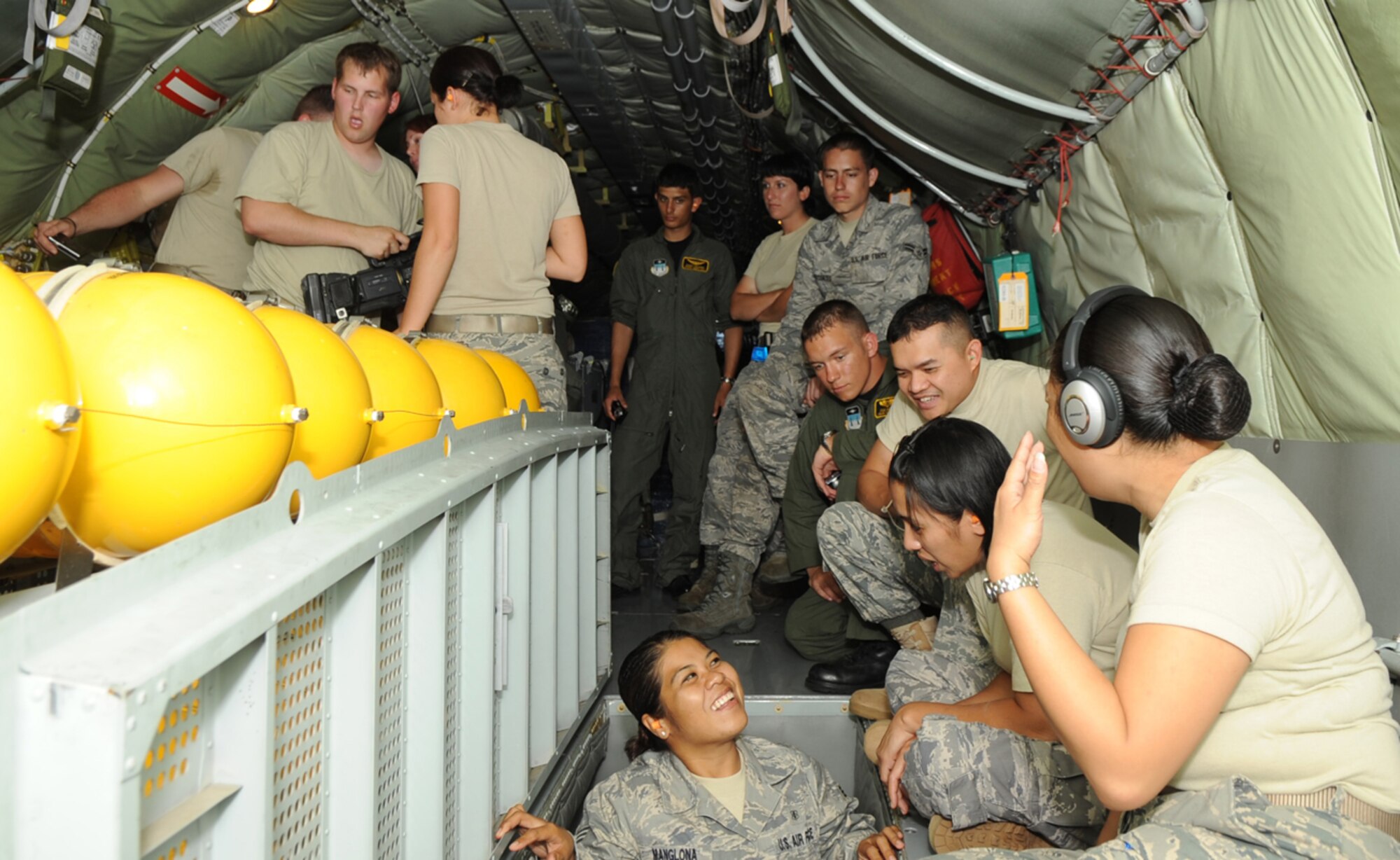 ANDERSEN AIR FORCE BASE, Guam -- Airmen and cadets sit near the rear of a KC-135 Stratotanker, June 4. The Airmen took turns watching a boom operator refuel an F-22 Raptor during an incentive flight over the Pacific Ocean. (U.S. Air Force photo by Senior Airman Christopher Bush)