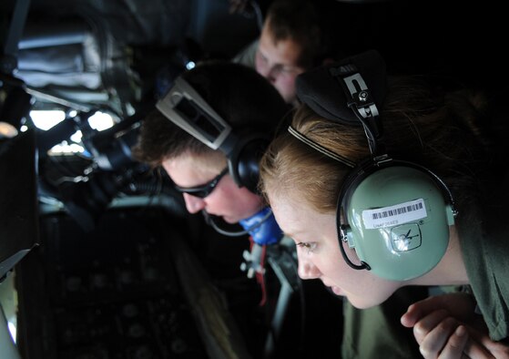 ANDERSEN AIR FORCE BASE, Guam -- Air Force cadet Elizabeth Norvell watches as a KC-135 Stratotanker boom operator refuels an F-22 Raptor, June 4.  The Woodland Hills, Calif., native is here from the Air Force Academy in Colorado Springs, Colo.  The cadets are here on a tour of the operational Air Force. (U.S. Air Force photo by Senior Airman Christopher Bush)