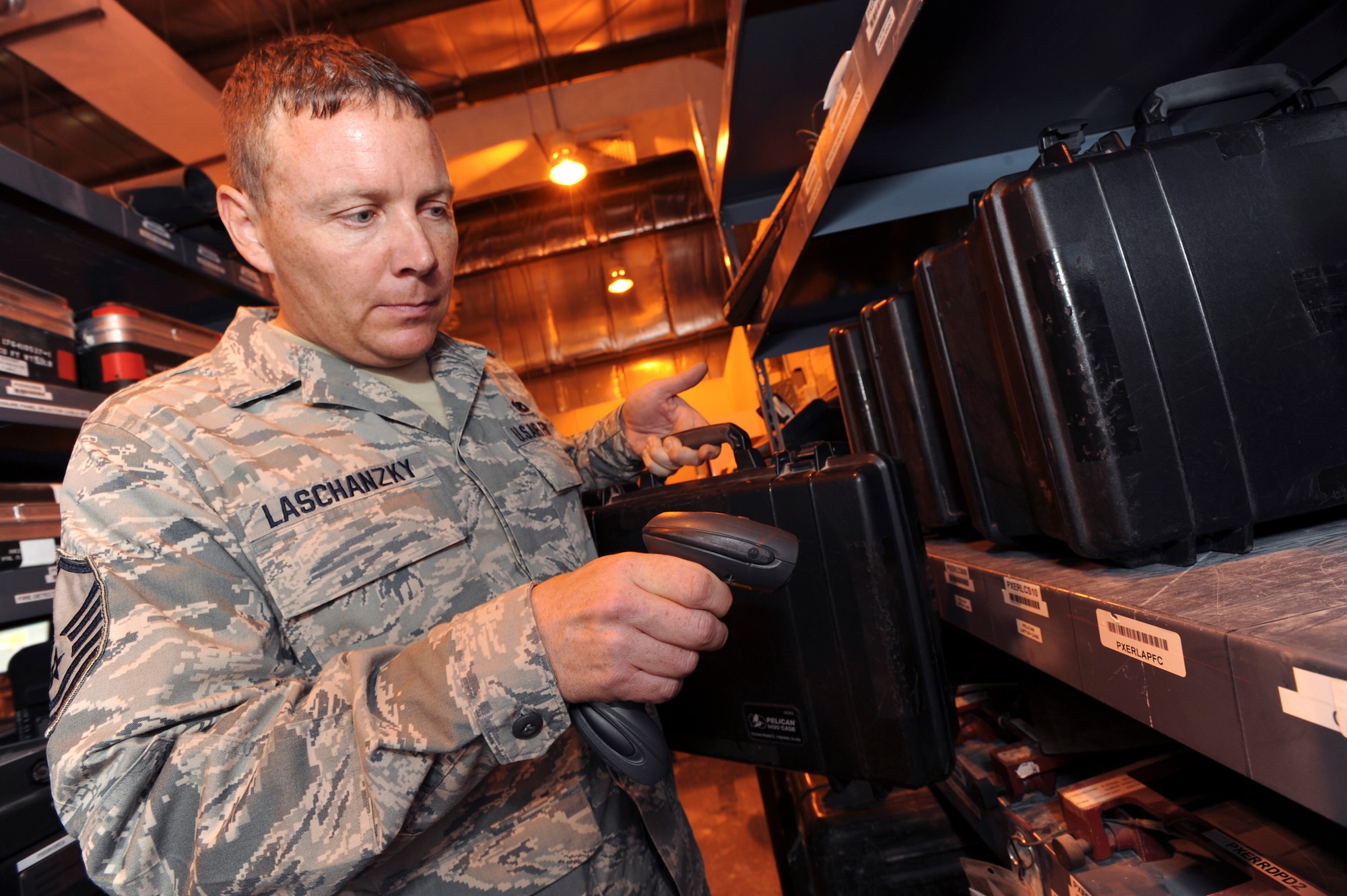 Master Sergeant Bradley Laschanzky, a composite toolkit technician with the 8th Expeditionary Air Mobility Squadron, scans out equipment prior to signing it over to a maintainer here, June 10, 2009, in an undisclosed location in Southwest Asia.  Items are signed out electronically to ensure accountability for all equipment issued for the day.  Sergeant Laschanzky is native to Austin, Texas and is a reservist deployed from Lackland Air Force Base, Texas, in support of Operations Iraqi and Enduring Freedom and Combined Joint Task Force - Horn of Africa.  (U.S. Air Force Photo by Staff Sgt. Joshua Garcia/released)