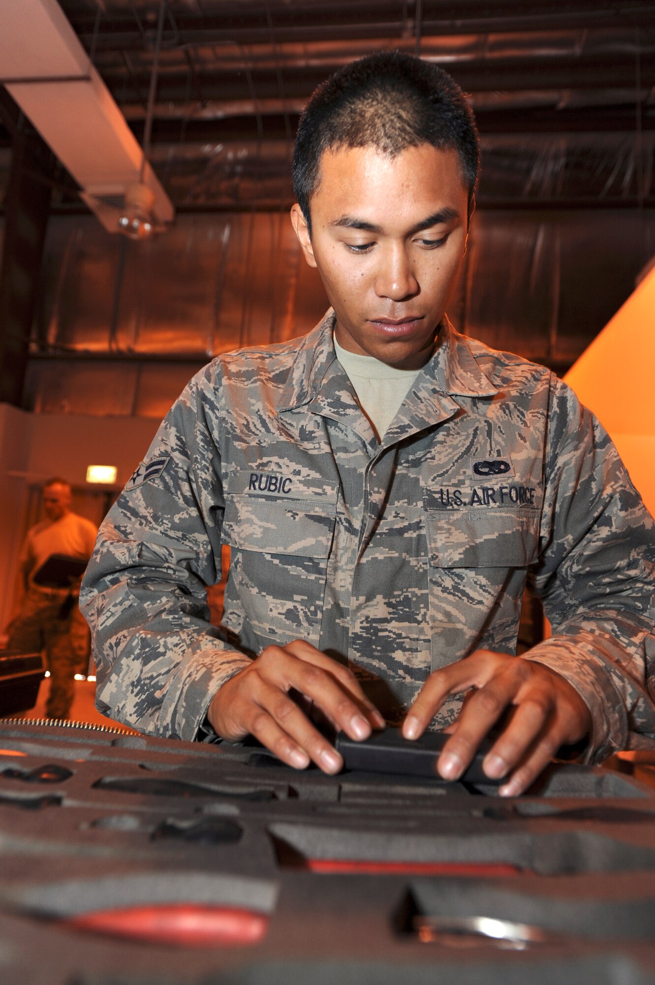 Airman 1st Class Phillip Rubic, an airspace propulsion mechanic with the 8th Expeditionary Air Mobility Squadron, ensures all tools are present prior to signing for them during shift change here, June 10, 2009, in an undisclosed location in Southwest Asia.  Prior to going out to the flightline, mechanics must inspect their toolkits to ensure all tools are present and accounted for.  Airman Rubic is native to San Diego Calif. and is deployed from Travis Air Force Base, Calif., in support of Operations Iraqi and Enduring Freedom and Combined Joint Task Force - Horn of Africa.  (U.S. Air Force Photo by Staff Sgt. Joshua Garcia/released)