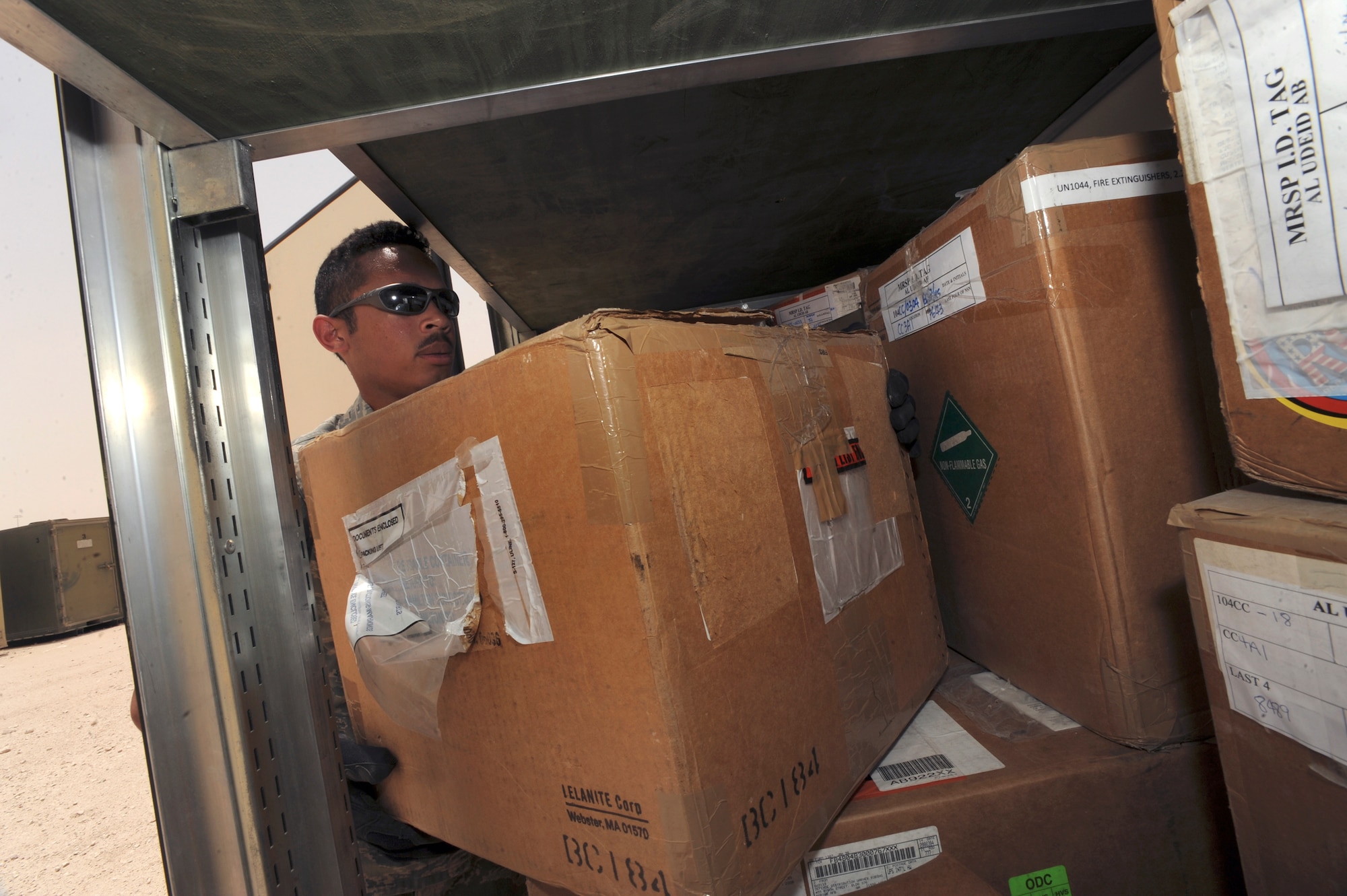 Senior Airman Luis Olivencia, a readiness spares package journeyman with the 8th Expeditionary Air Mobility Squadron picks C-17 Globemaster III aircraft parts from a parts storage bin here, June 10, 2009, in and undisclosed location in Southwest Asia.  Airman Olivencia issues out all aircraft parts and equipment maintainers may need to maintain the aircraft.  Airman Olivencia is native to Norwalk, Conn. and is deployed from Dover Air Force Base, Del., in support of Operations Iraqi and Enduring Freedom and Combined Joint Task Force - Horn of Africa.  (U.S. Air Force Photo by Staff Sgt. Joshua Garcia/released)