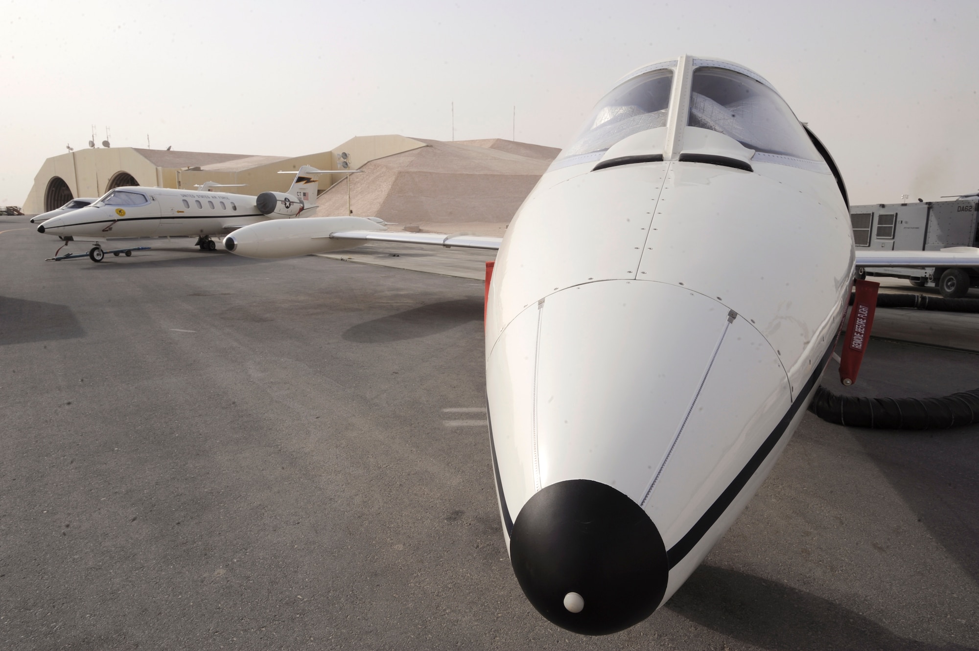 A group of C-21 transport aircraft from the 379th Expeditionary Operations Group is parked ready for missions to come, June 10, 2009 in an undisclosed location in Southwest Asia.  The C-21 is based on the Learjet 35 business jet with the main mission here of transporting distinguish visitors to various locations within the U.S. Central Command's area of responsibility.  (U.S. Air Force Photo by Staff Sgt. Joshua Garcia/released)