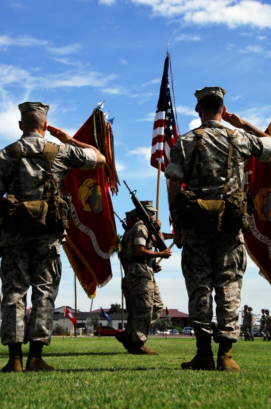 The Marine Aircraft Group 13 color guard marches past Col. Clyde M. Woltman, left, the unit’s former commanding officer and Col. Anton H. Nerad, the new commanding officer, during their change of command at the Marine Corps Air Station in Yuma, Ariz., June 12, 2009. Woltman will continue on to Headquarters Marine Corps in Washington, D.C., to work in the plans, policies and operations department. Nerad is taking command of the unit after serving in various billets with the 1st Marine Aircraft Wing in Okinawa, Japan.