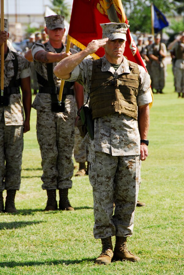 Col. Clyde M. Woltman, former Marine Aircraft Group 13 commanding officer salutes Maj. Gen. Terry Robling, the 3rd Marine Aircraft Wing commanding general, before he is awarded the Legion of Merit during his change of command at the Marine Corps Air Station in Yuma, Ariz., June 12, 2009. The medal—Woltman’s second—reflects his achievements during his two years in command including streamlining maintenance and logistics to keep more Harriers in operation and the unit’s approximately 13,000 sorties flown. Woltman will continue on to Headquarters Marine Corps in Washington, D.C., to work in the plans, policies and operations department. Nerad is taking command of the unit after serving in various billets with the 1st Marine Aircraft Wing in Okinawa, Japan.